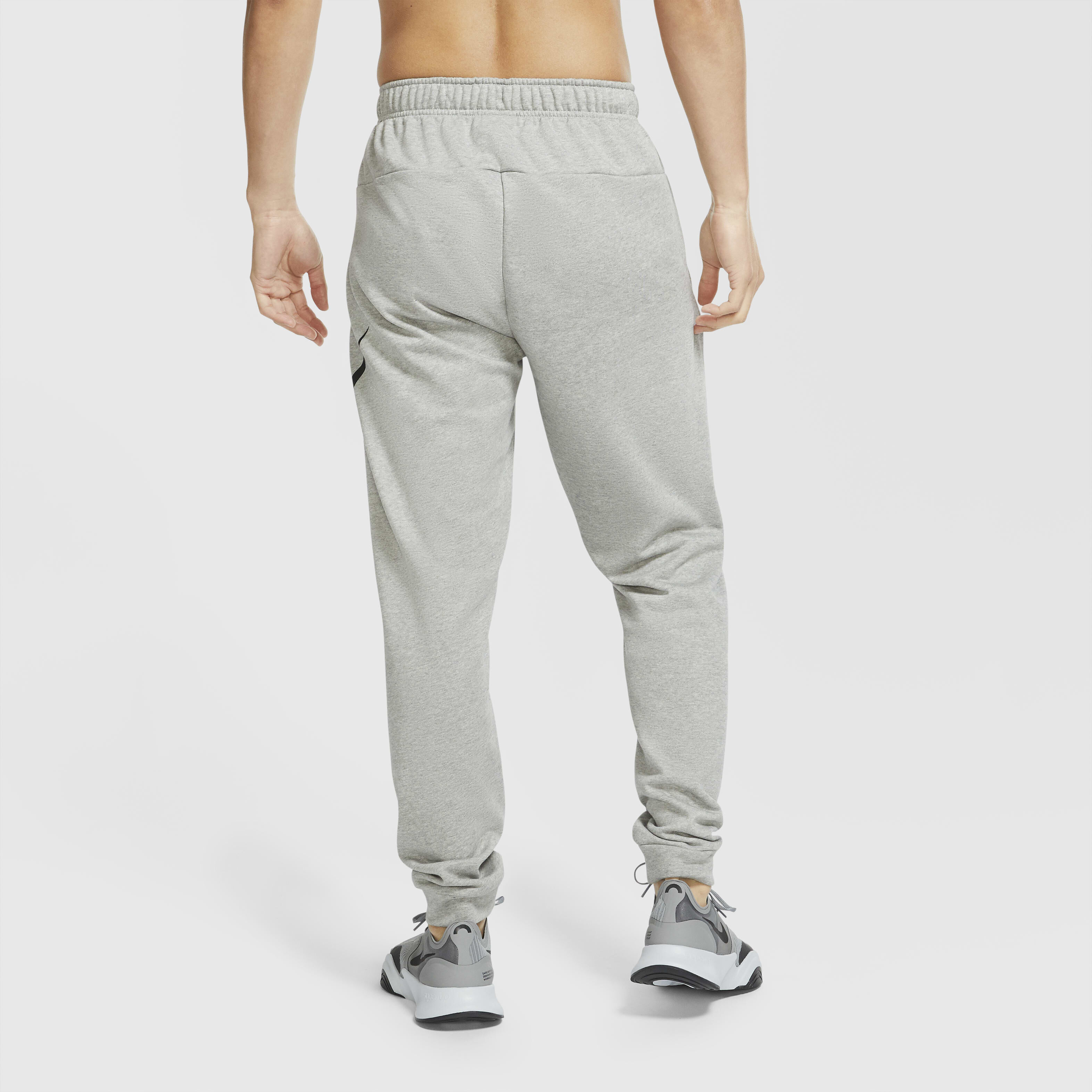 Buy Nike Dry Graphic Men s Dri FIT Taper Fitness Trousers Dark Grey Heather Black Nike Saudi Official