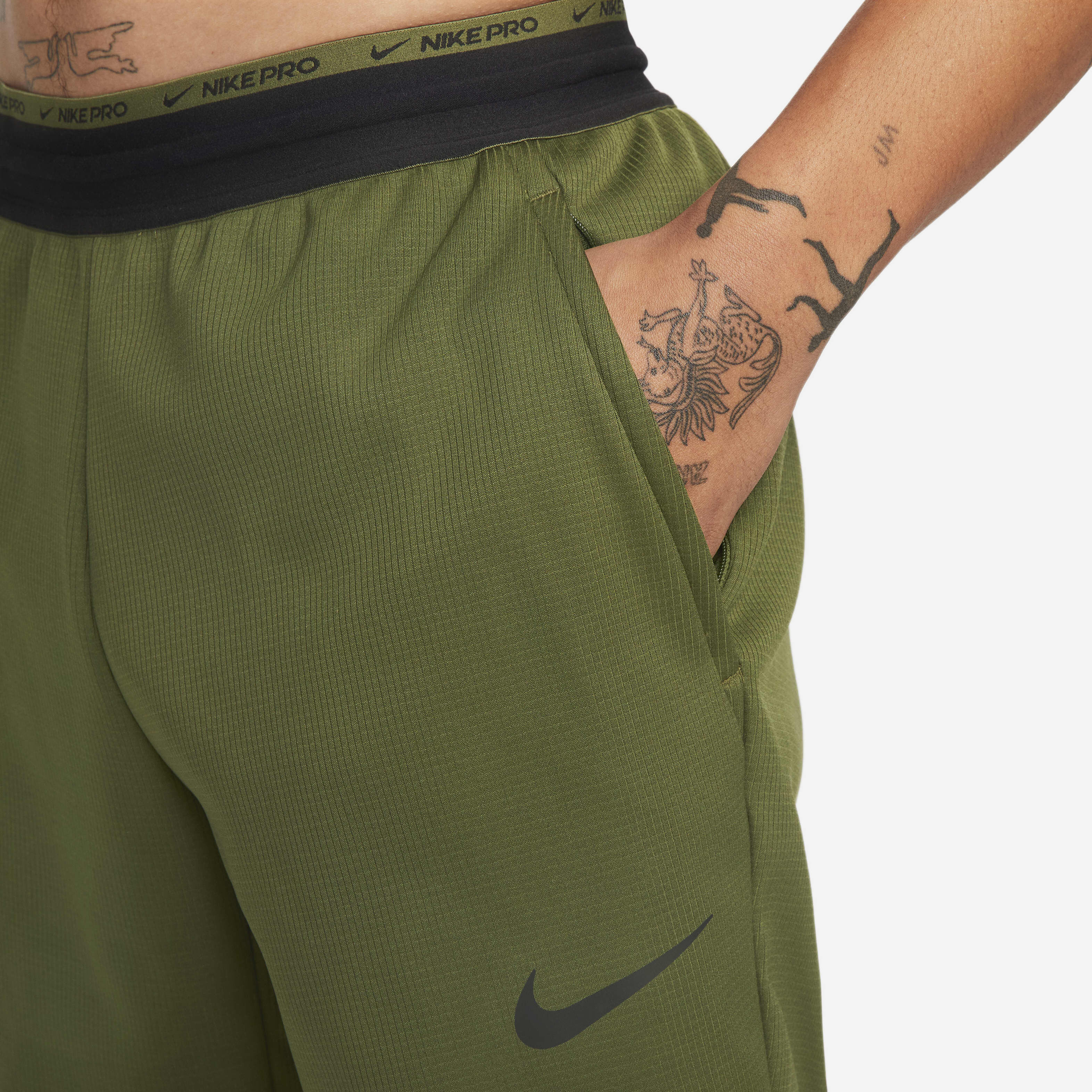 Buy Nike Therma Sphere Men s Therma FIT Fitness Trousers Rough Green Pilgrim Black Nike Saudi Official