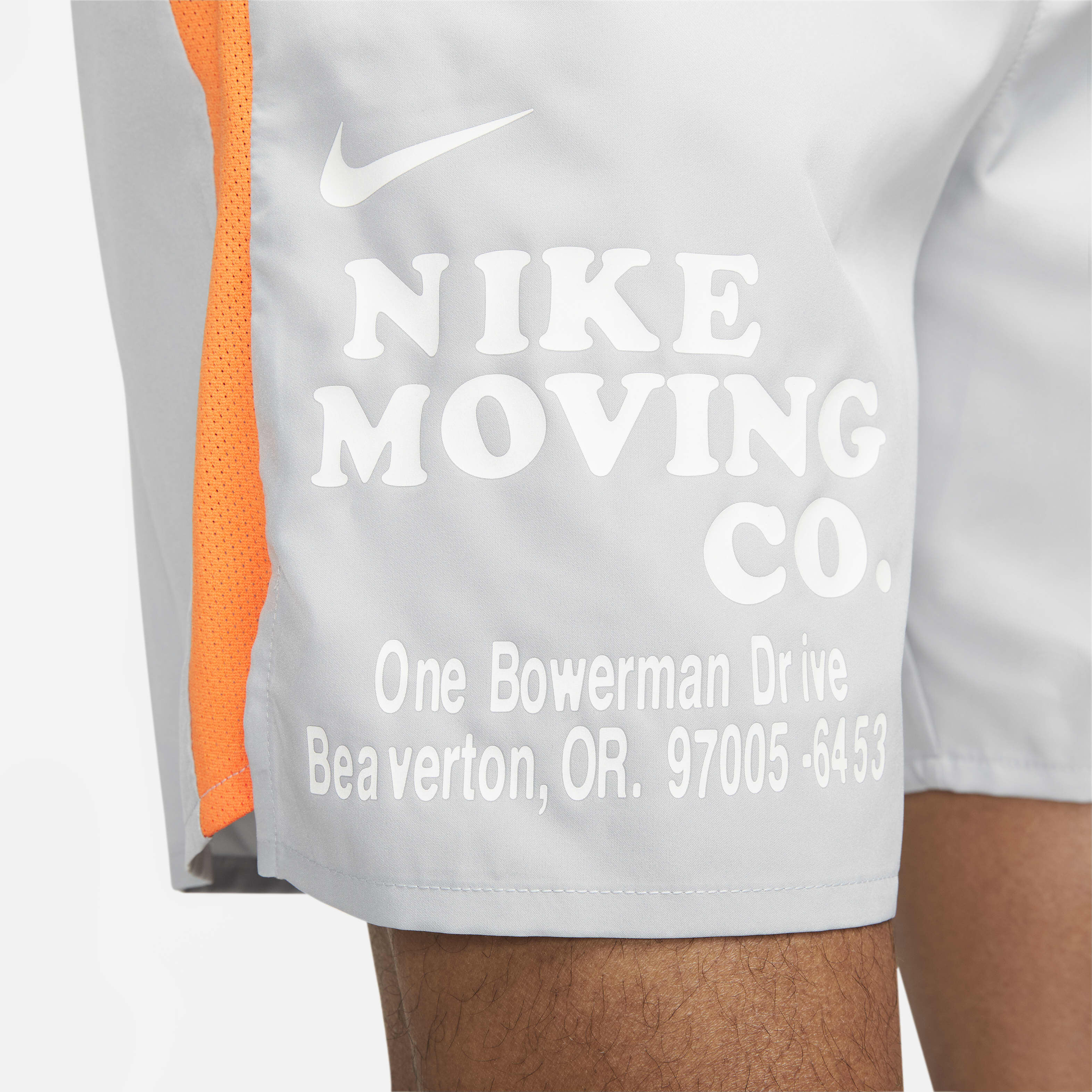 Buy Nike Dri-FIT Challenger Men's 18cm (approx.) Unlined Versatile Shorts -  Light Smoke Grey/Bright Mandarin/Black/Summit White | Nike Saudi Official