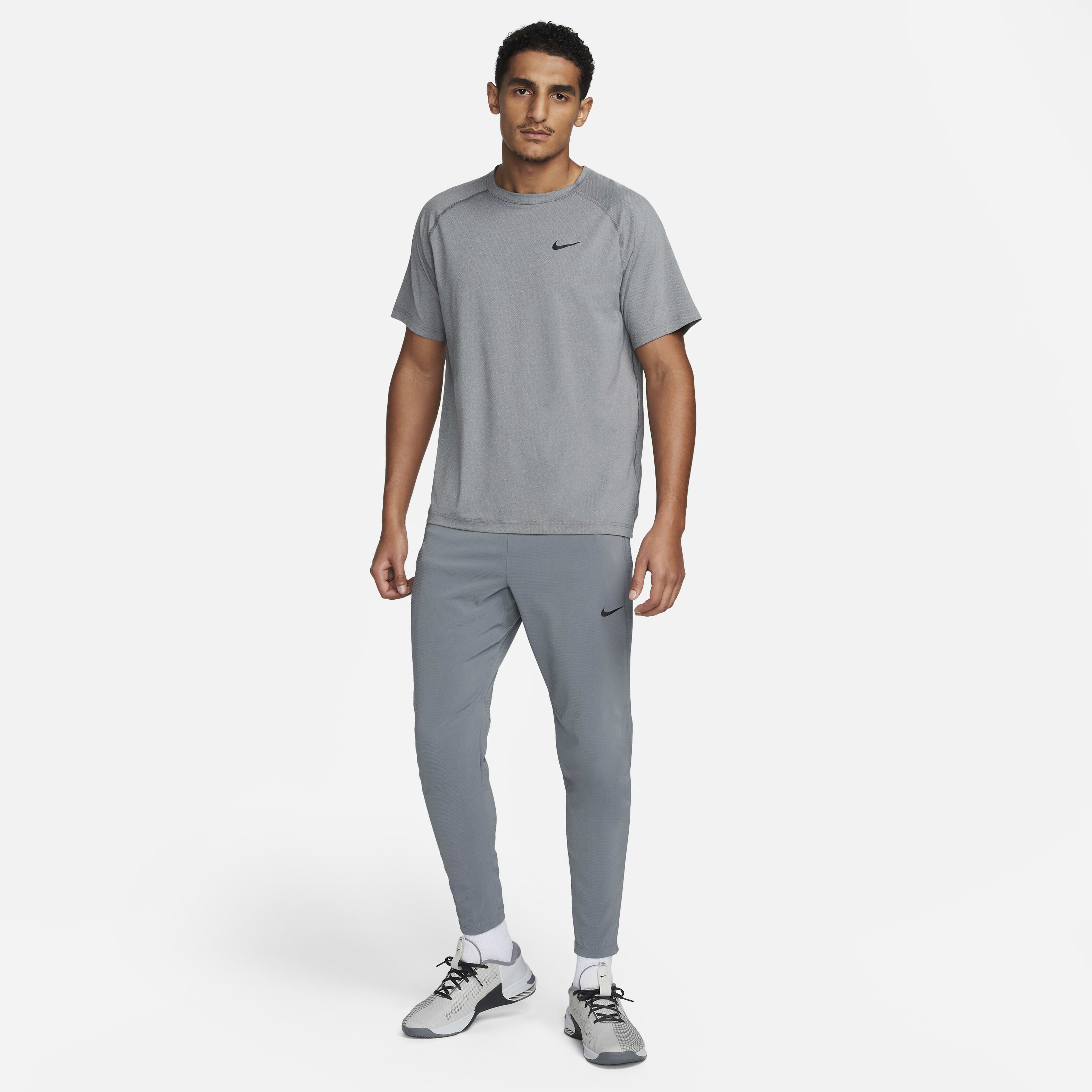 Buy Nike Flex Rep Men s Dri FIT Fitness Trousers Smoke Grey Black Black Nike Saudi Official