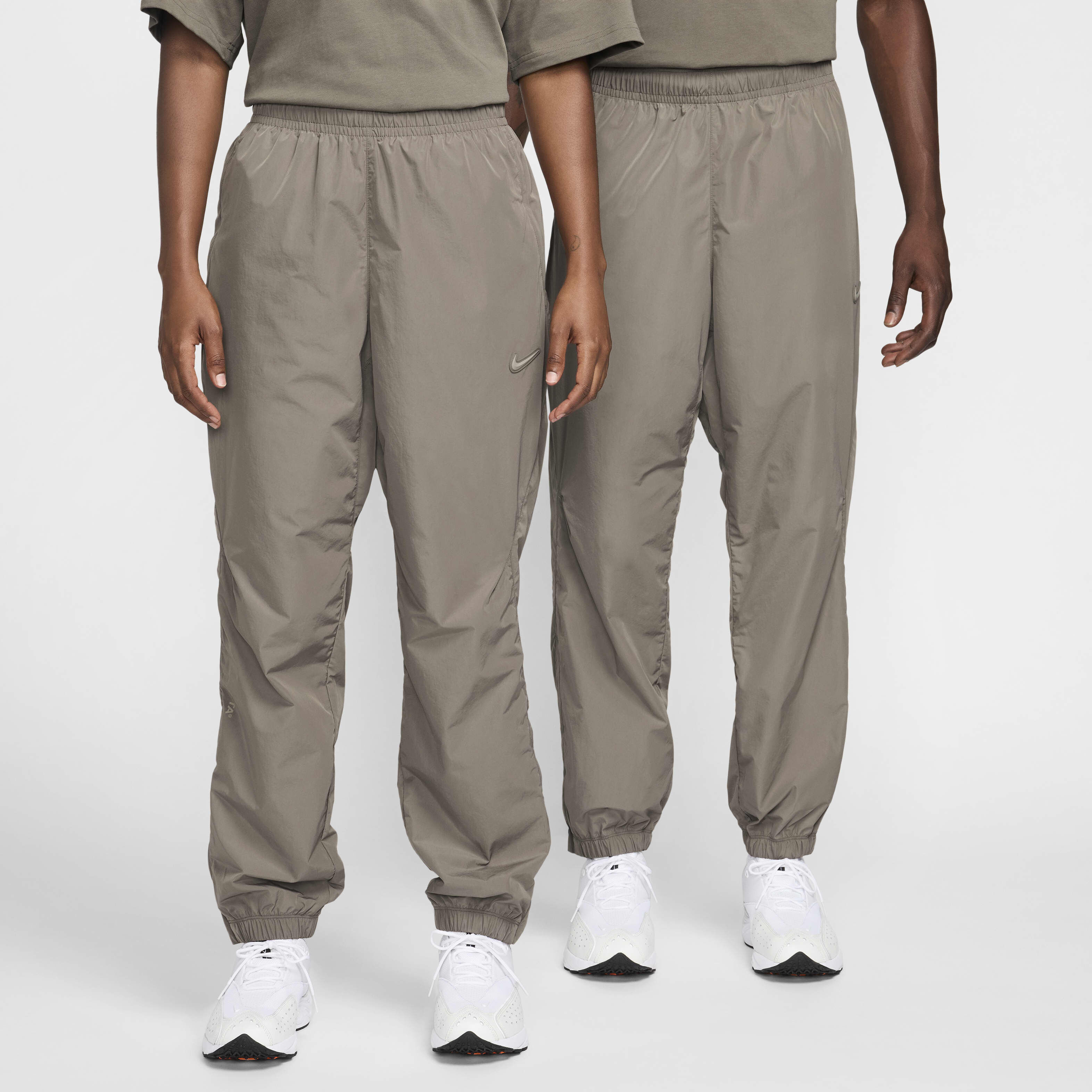 Buy NOCTA Northstar Nylon Tracksuit Bottoms - Olive Grey/Moon Fossil/Moon  Fossil | Nike Saudi Official