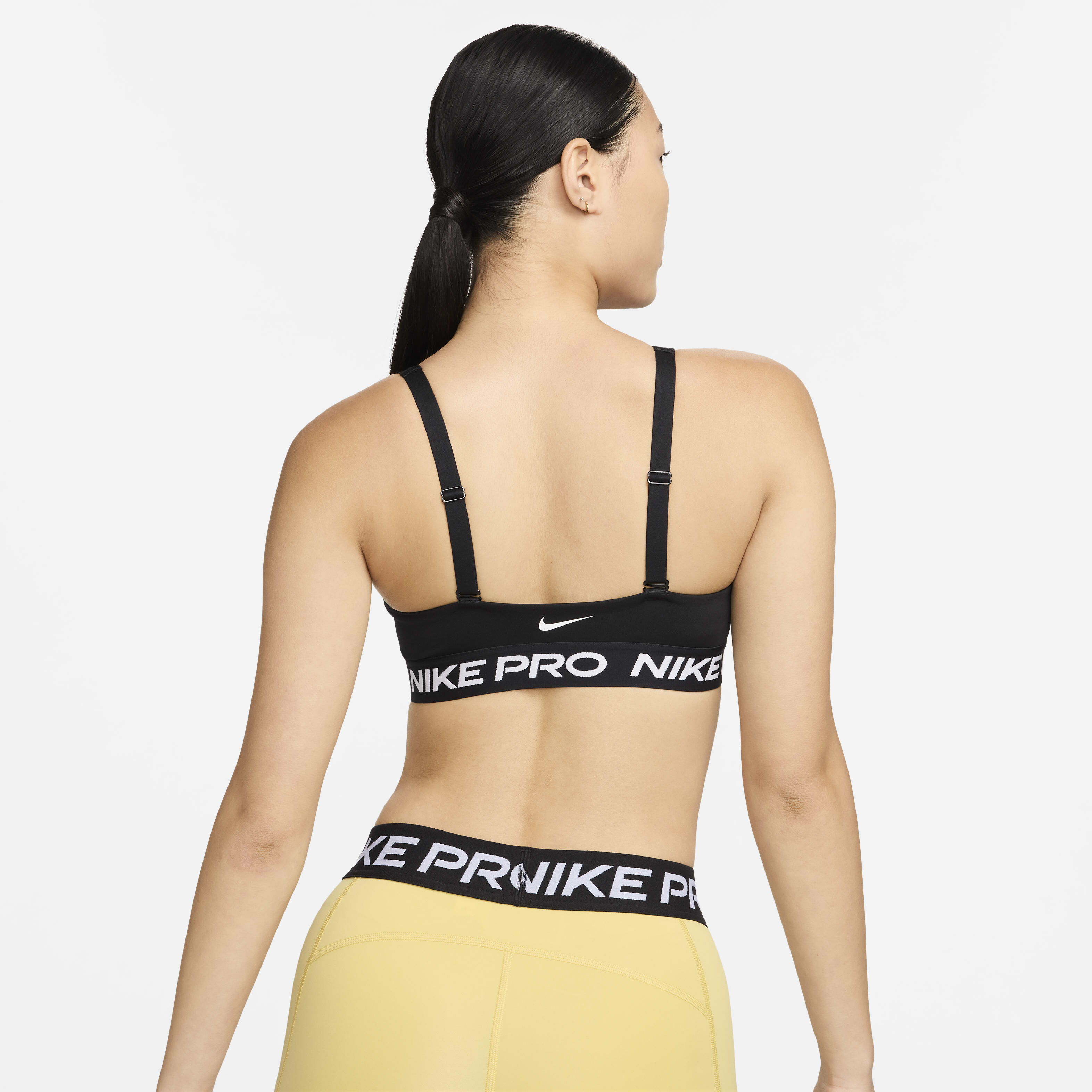 Buy Nike Pro Indy Plunge Women s Medium Support Padded Sports Bra Black White Nike Saudi Official