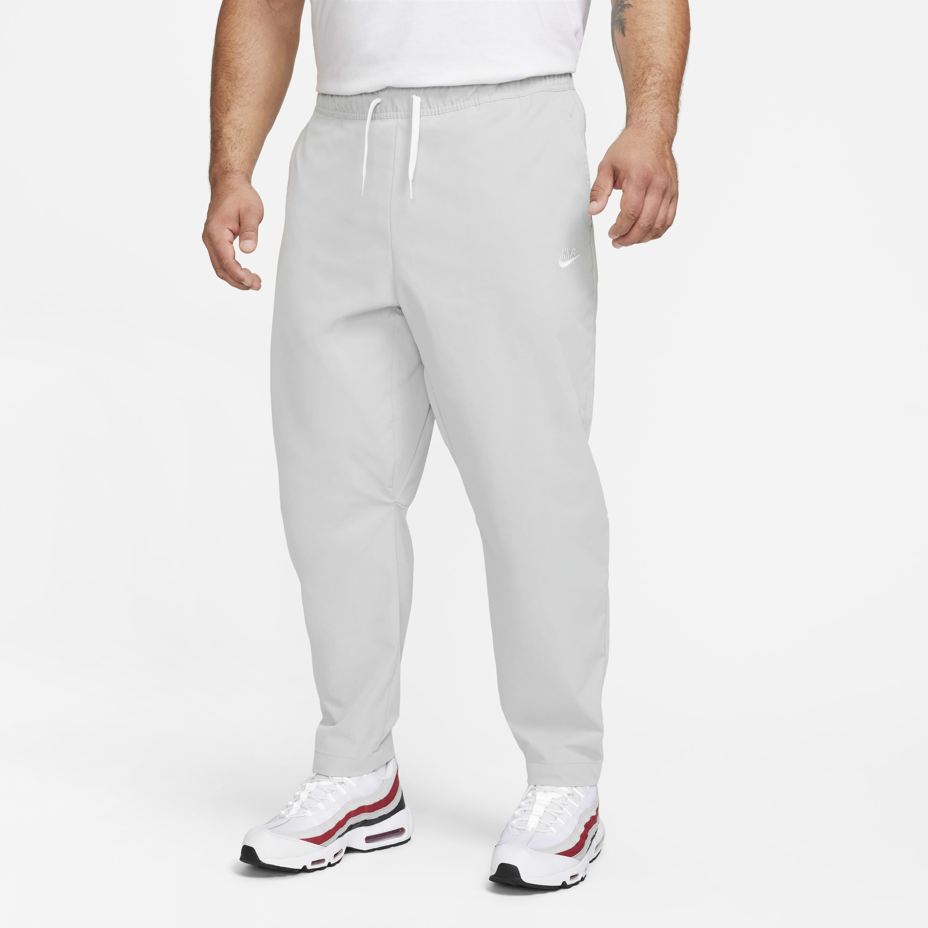 Buy Nike Club Men s Woven Tapered Leg Trousers Nike Saudi Official