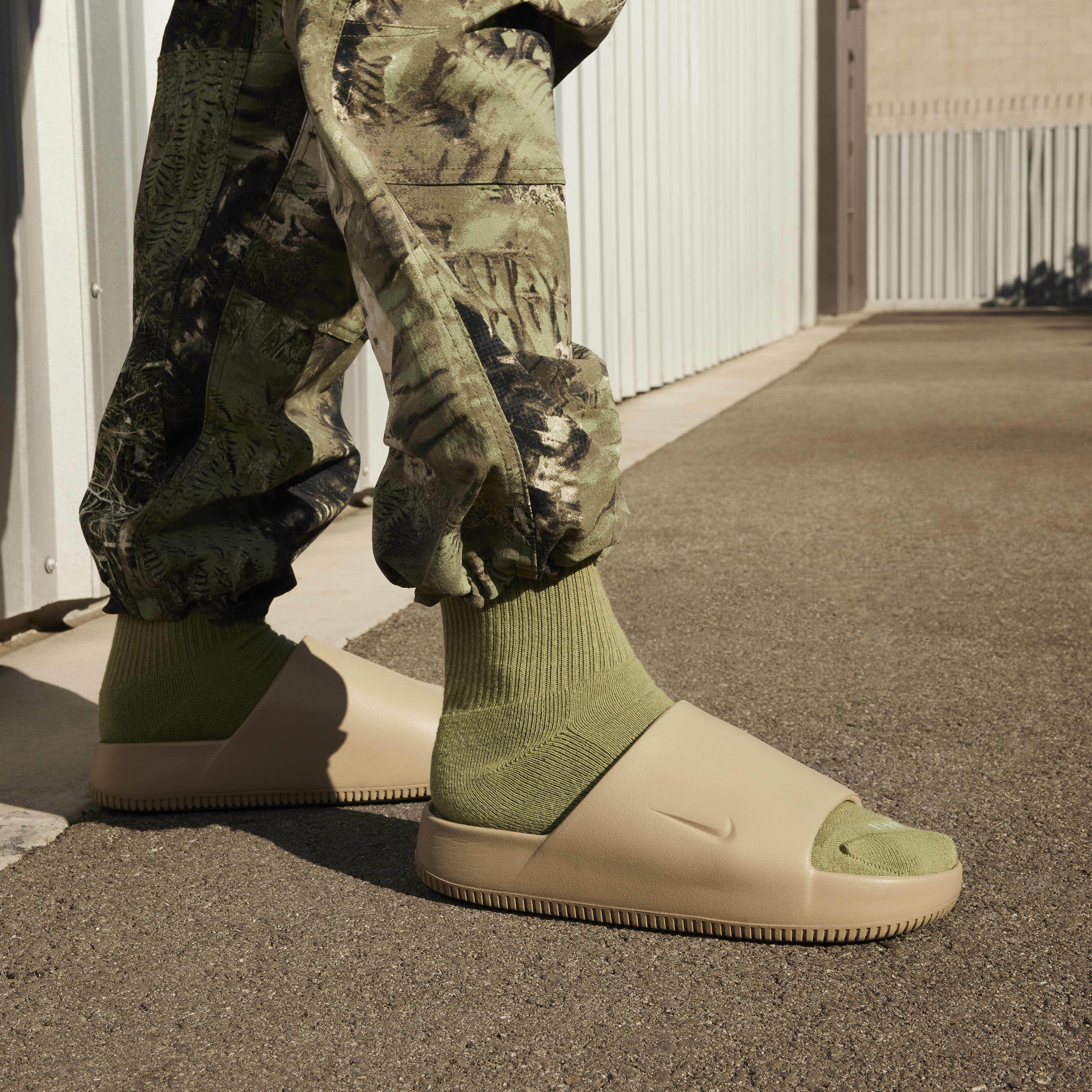 Buy Nike Calm Men s Slides Khaki Khaki Nike Saudi Official