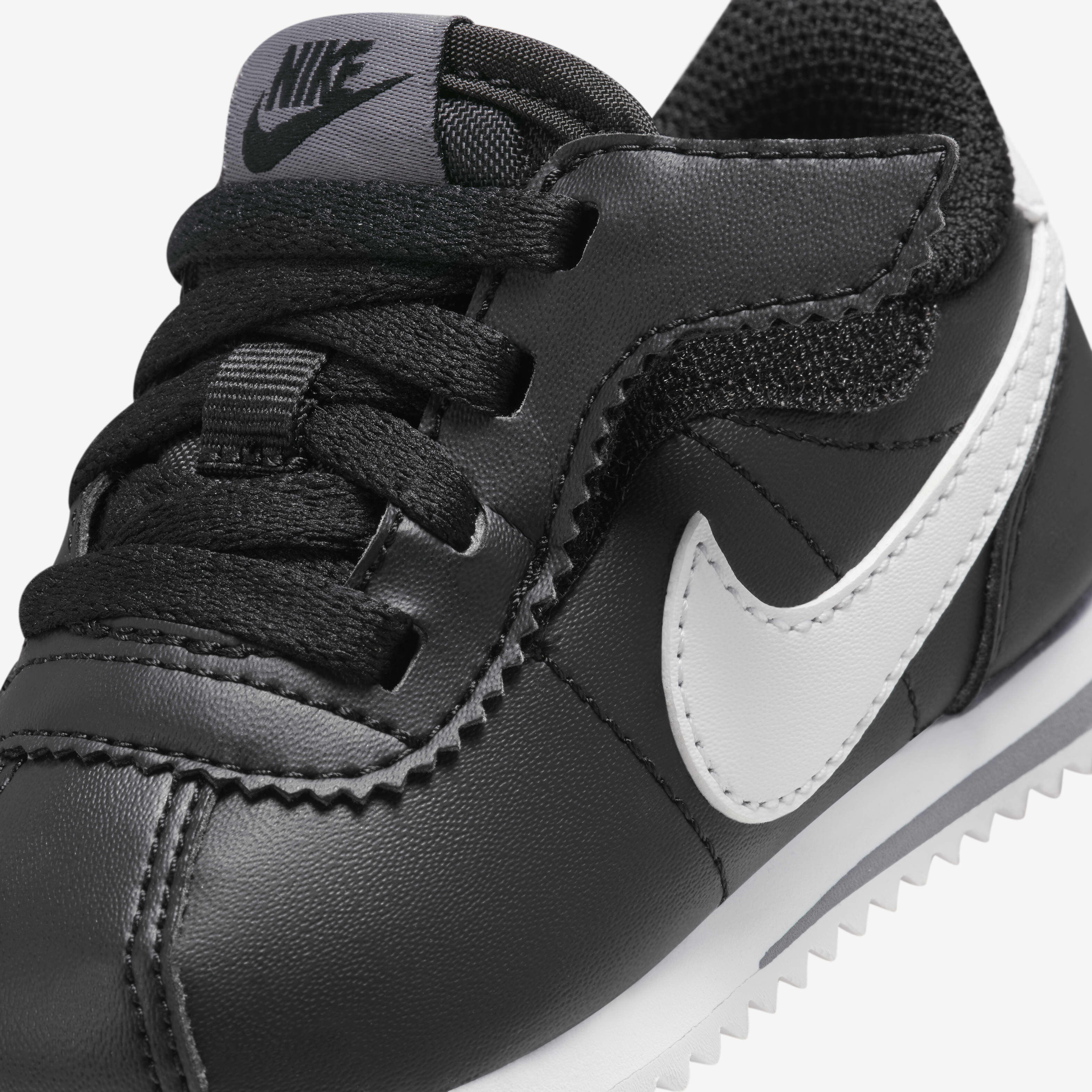 Nike cortez black kids top