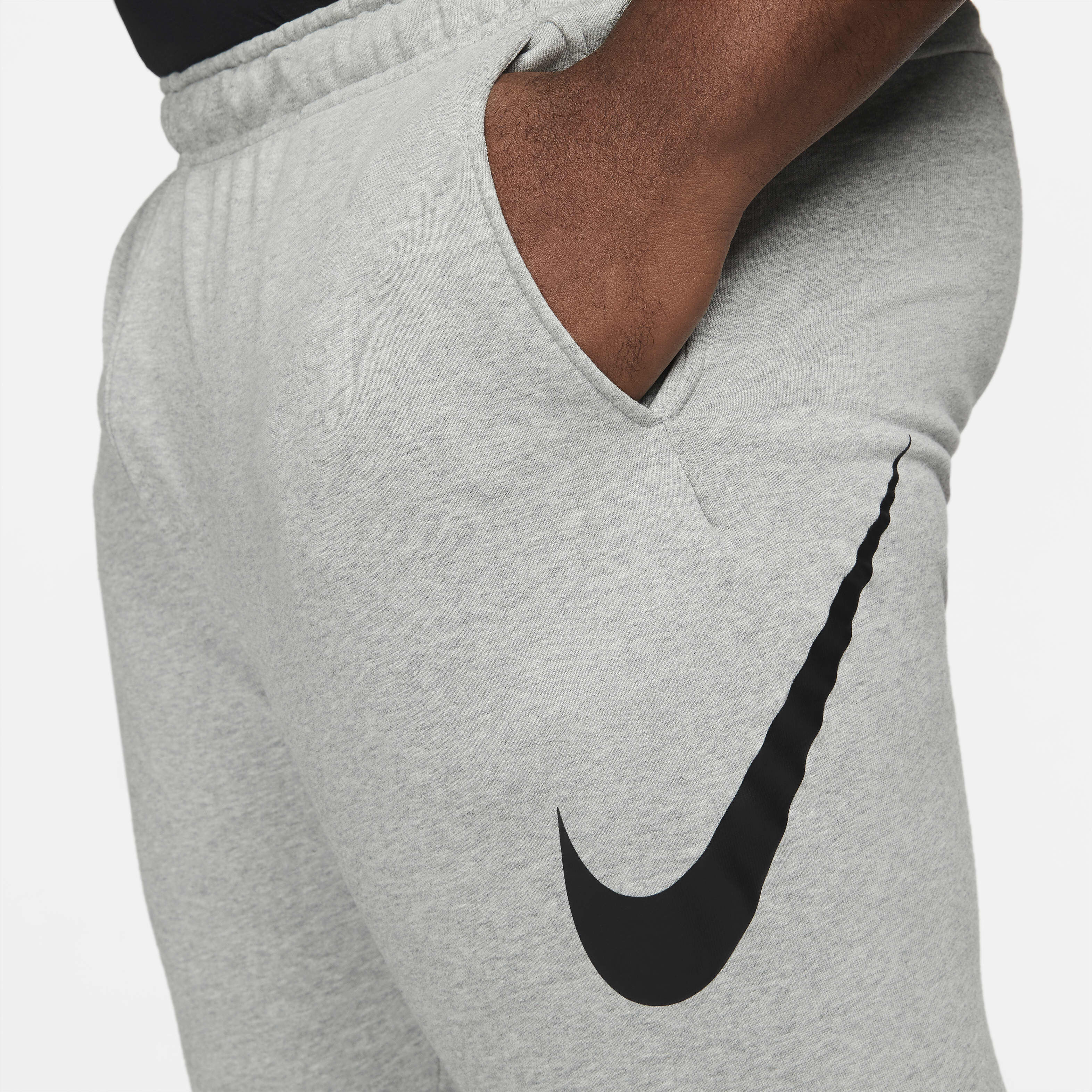 Buy Nike Dry Graphic Men s Dri FIT Taper Fitness Trousers Dark Grey Heather Black Nike Saudi Official