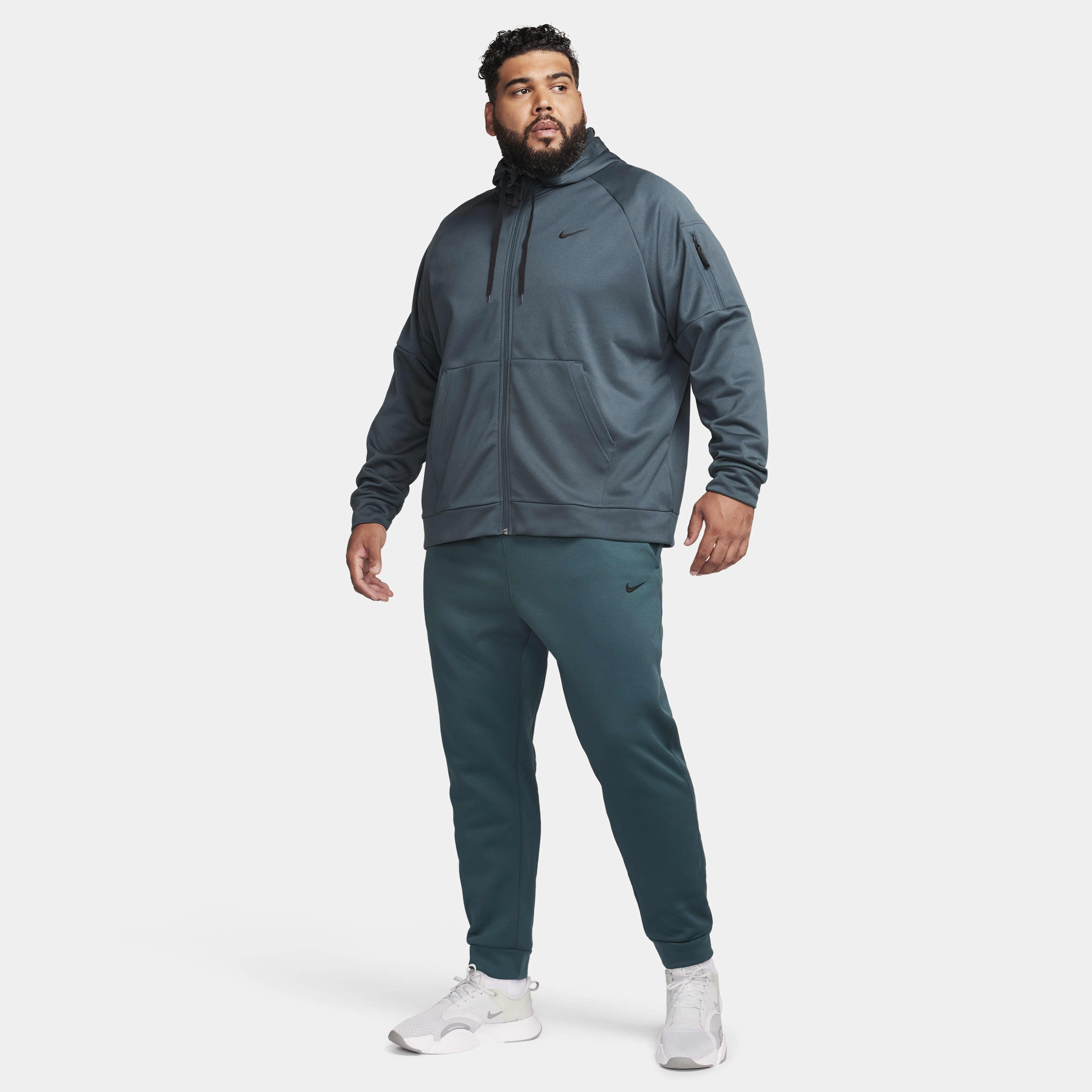 Buy Nike Therma Men s Therma FIT Tapered Fitness Trousers Obsidian Obsidian Black Nike Saudi Official