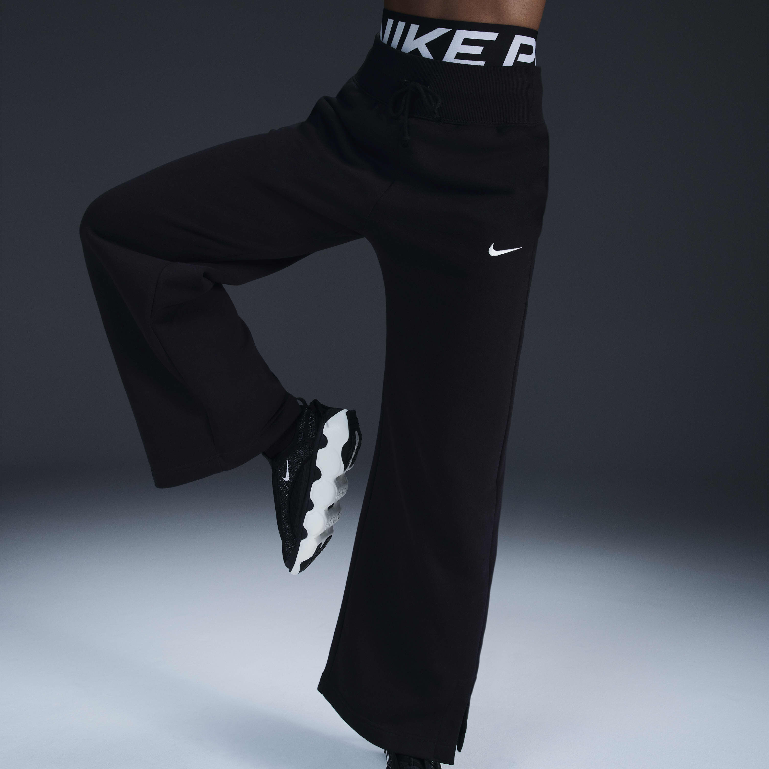 Buy Nike Sportswear Phoenix Fleece Women s High Waisted Wide Leg Tracksuit Bottoms Nike Saudi Official