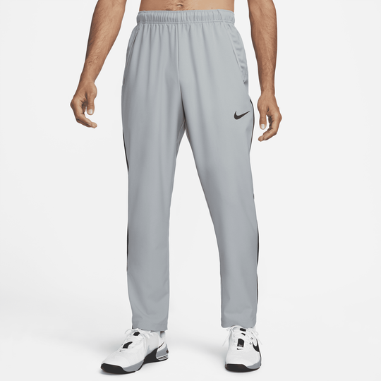 Shop Dri FIT Men s Woven Team Training Trousers Nike KSA