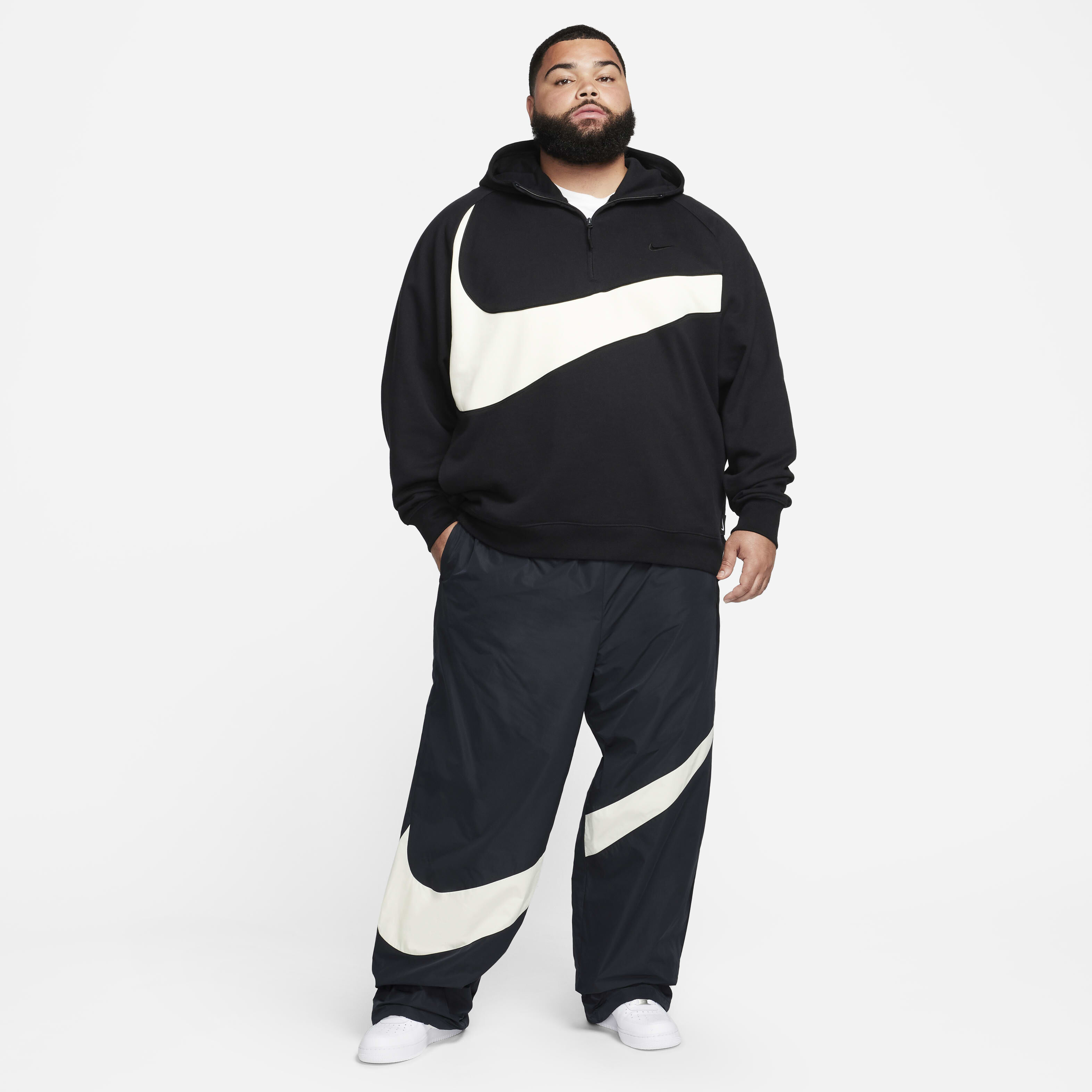 Nike swoosh woven pant top