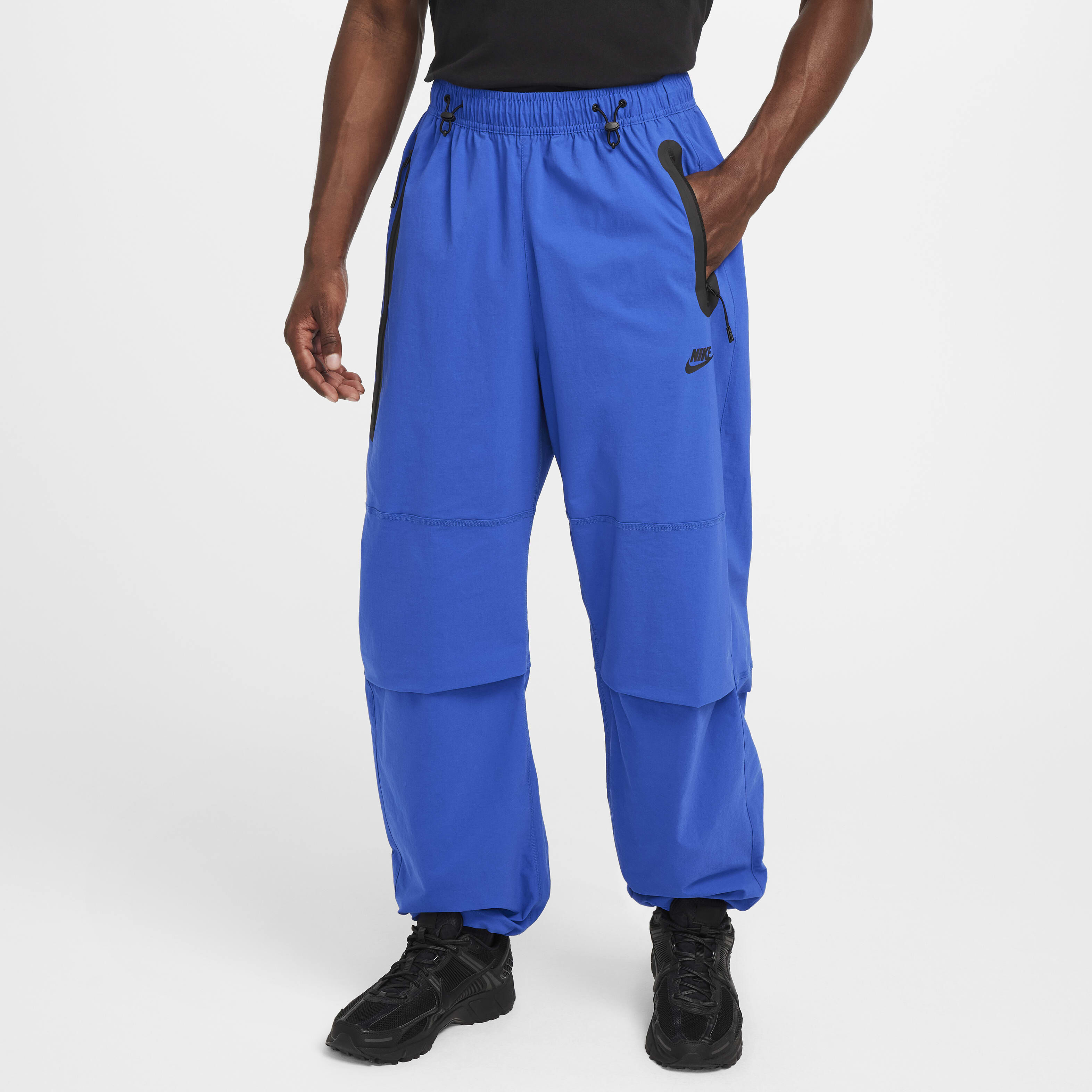 Buy Nike Tech Men s Woven Oversized Trousers Game Royal Game Royal Black Nike Saudi Official