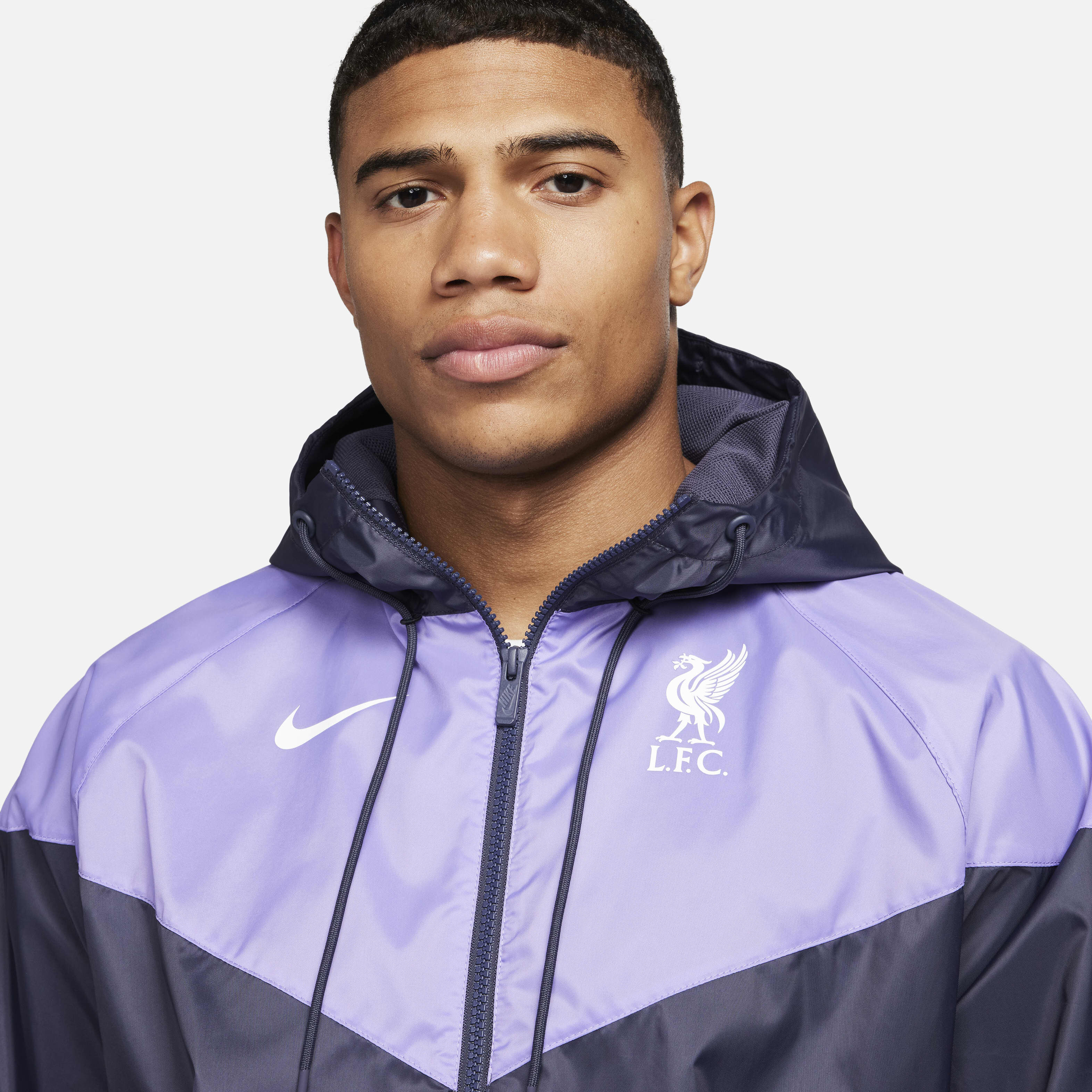 Buy Liverpool F.C. Sport Essentials Windrunner Men s Nike Hooded Football Jacket Space Purple Gridiron White Nike Saudi Official