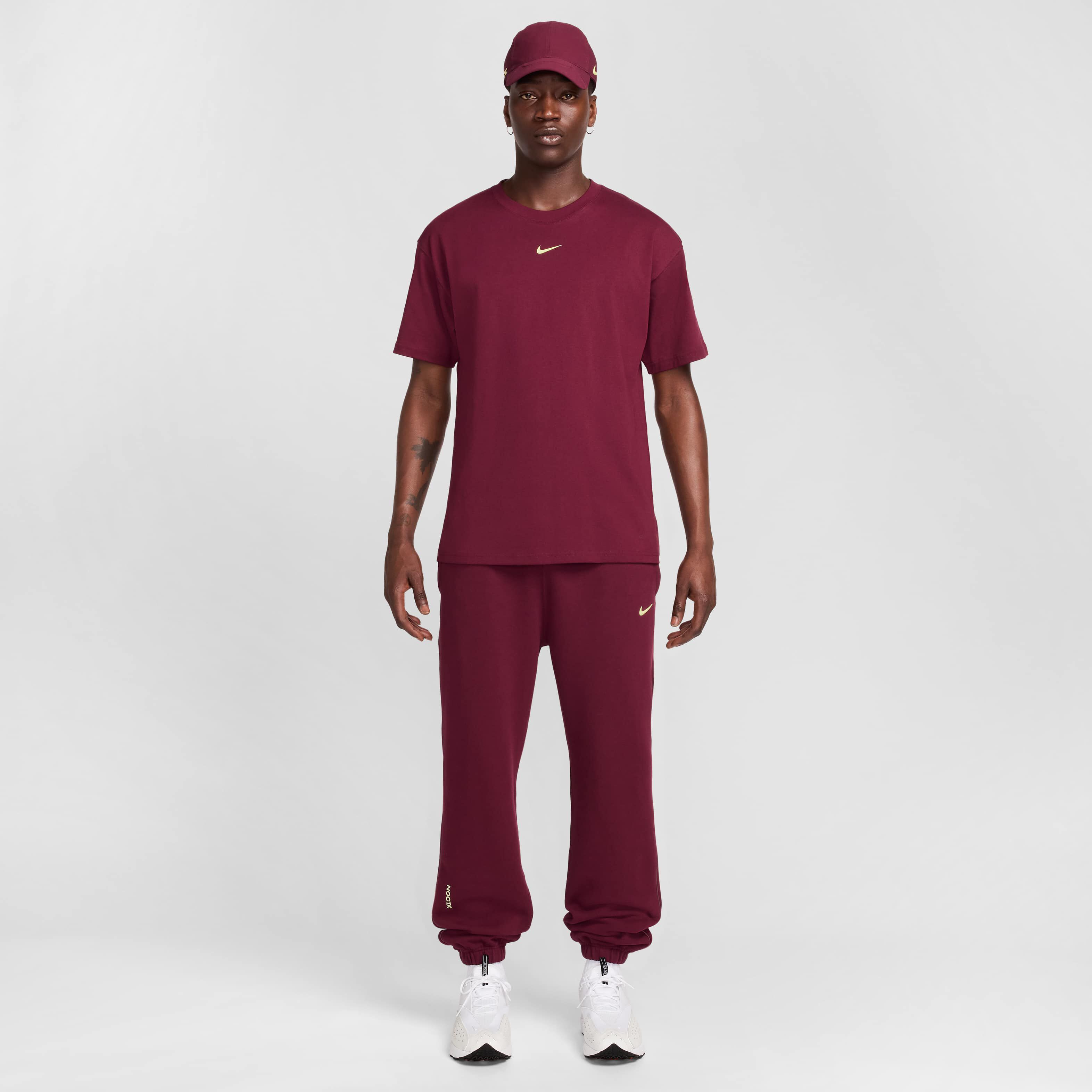 Buy NOCTA T-Shirt - Dark Beetroot/Citron Tint | Nike Saudi