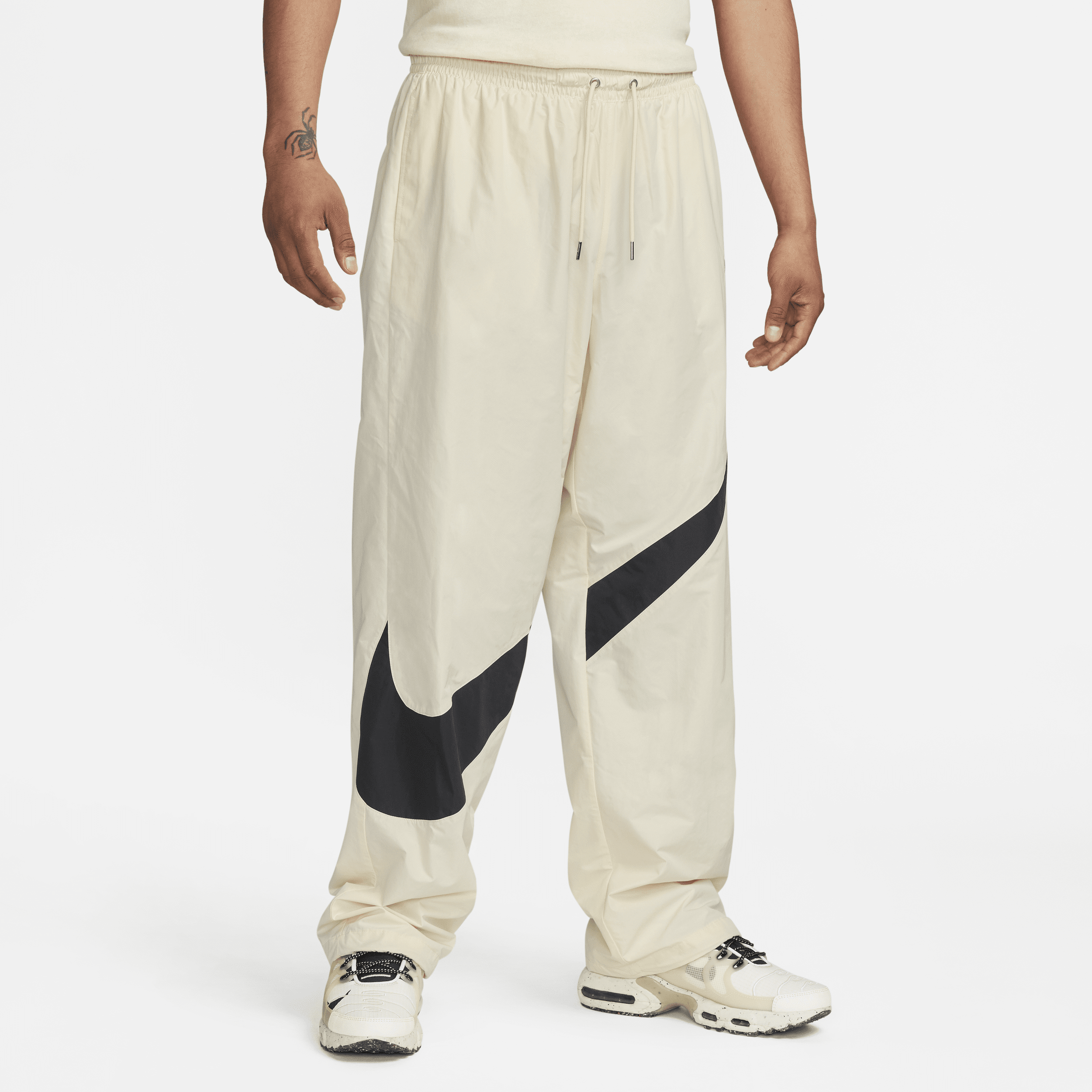 Shop Swoosh Men's Woven Trousers