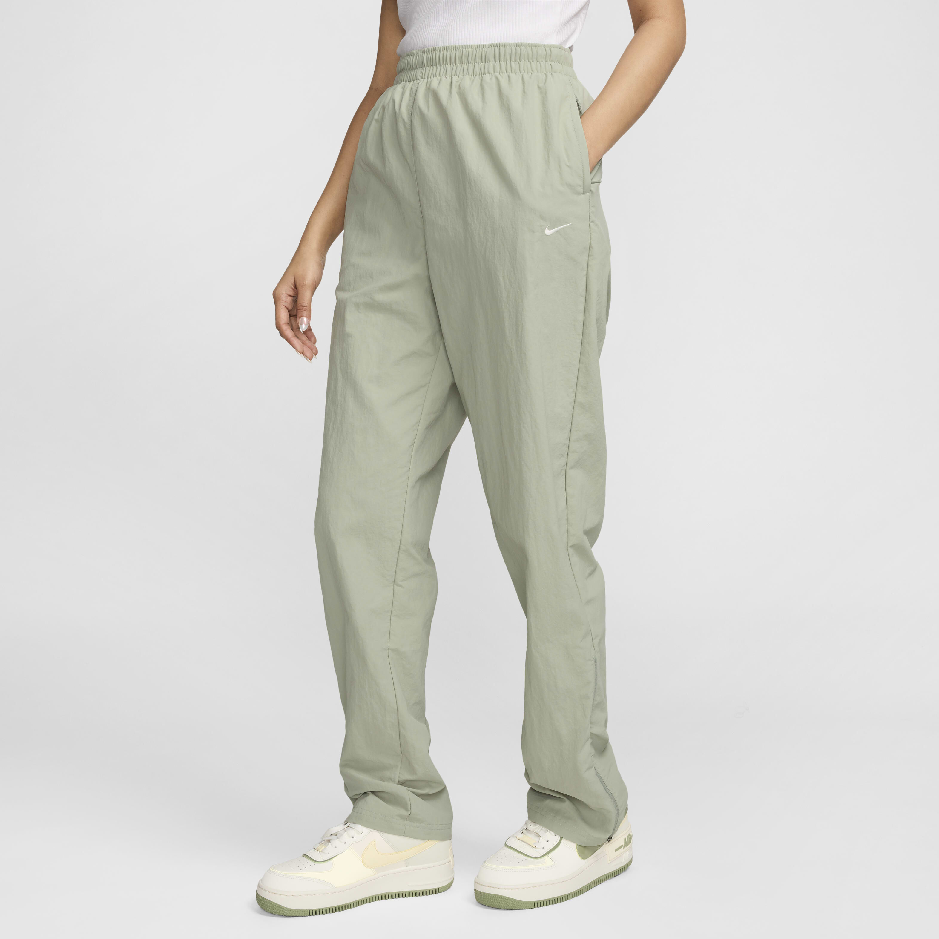 Buy Nike Sportswear Essential Women s UV High Waisted Open Hem Zip Trousers Jade Horizon Sail Nike Saudi Official