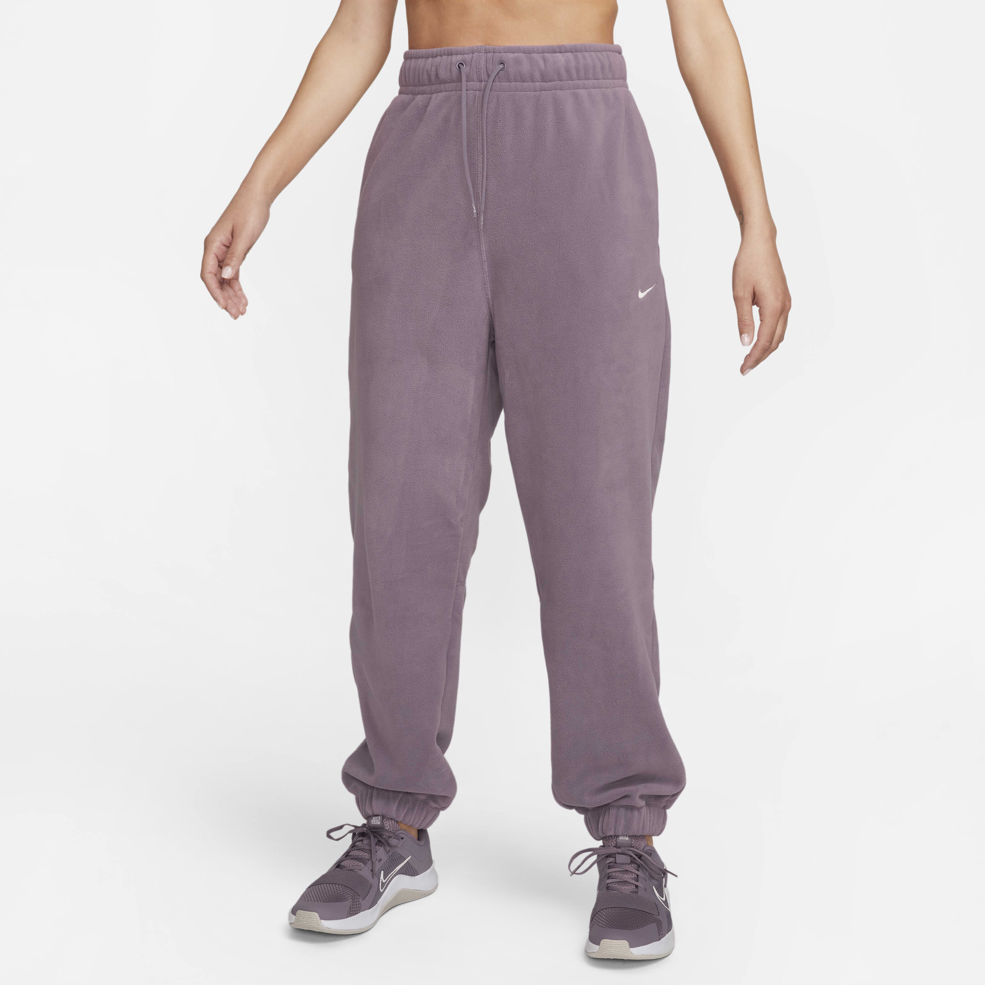 Buy Nike Therma FIT One Women s Loose Fleece Trousers Violet Dust Pale Ivory Nike Saudi Official