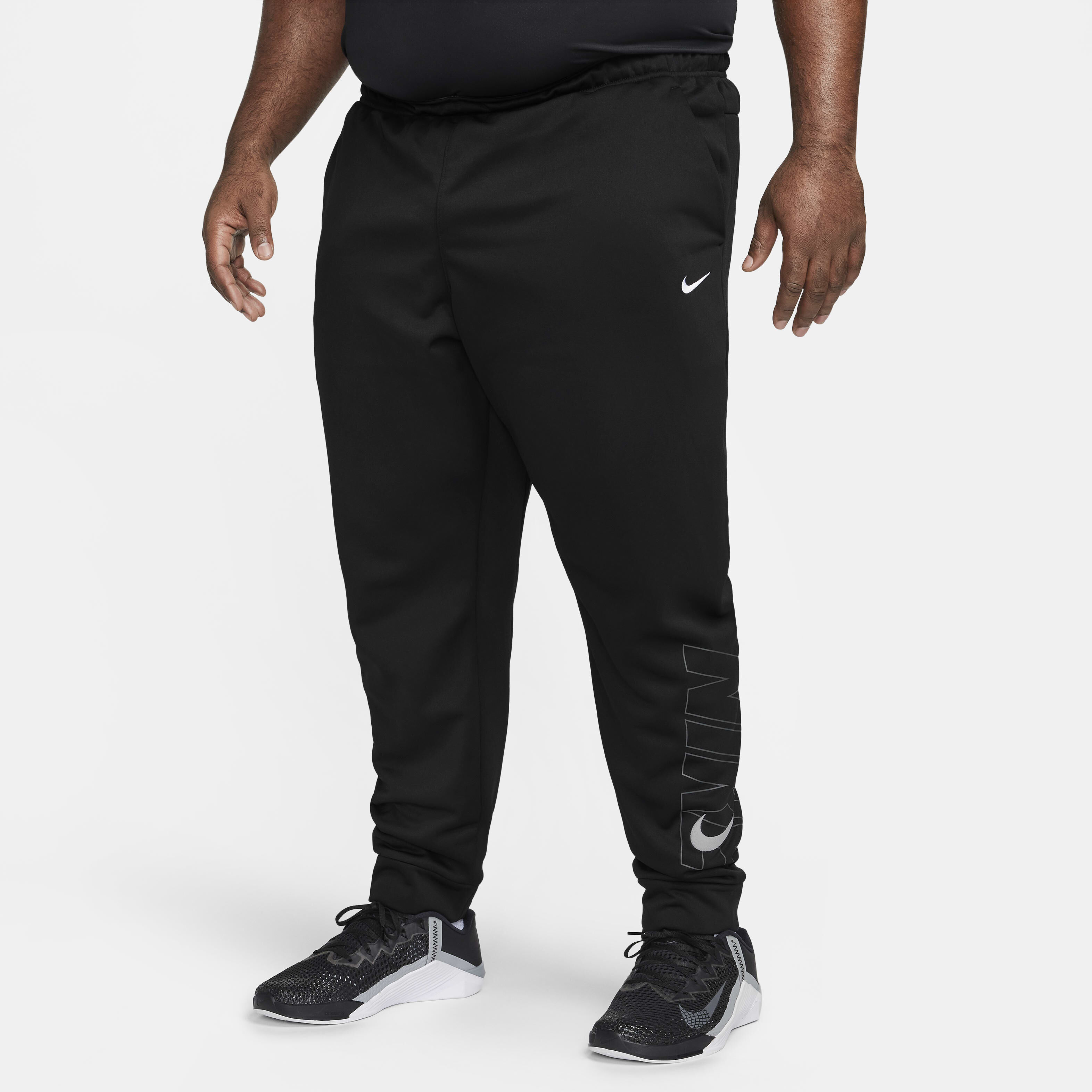 Buy Nike Therma FIT Men s Tapered Fitness Trousers Black White Nike Saudi Official