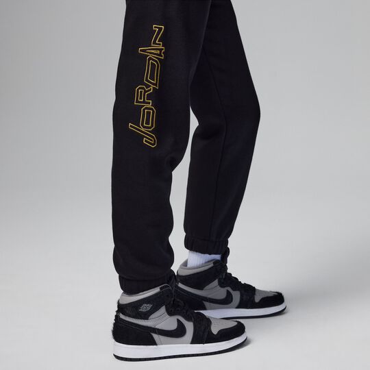 White and 2025 gold nike pants