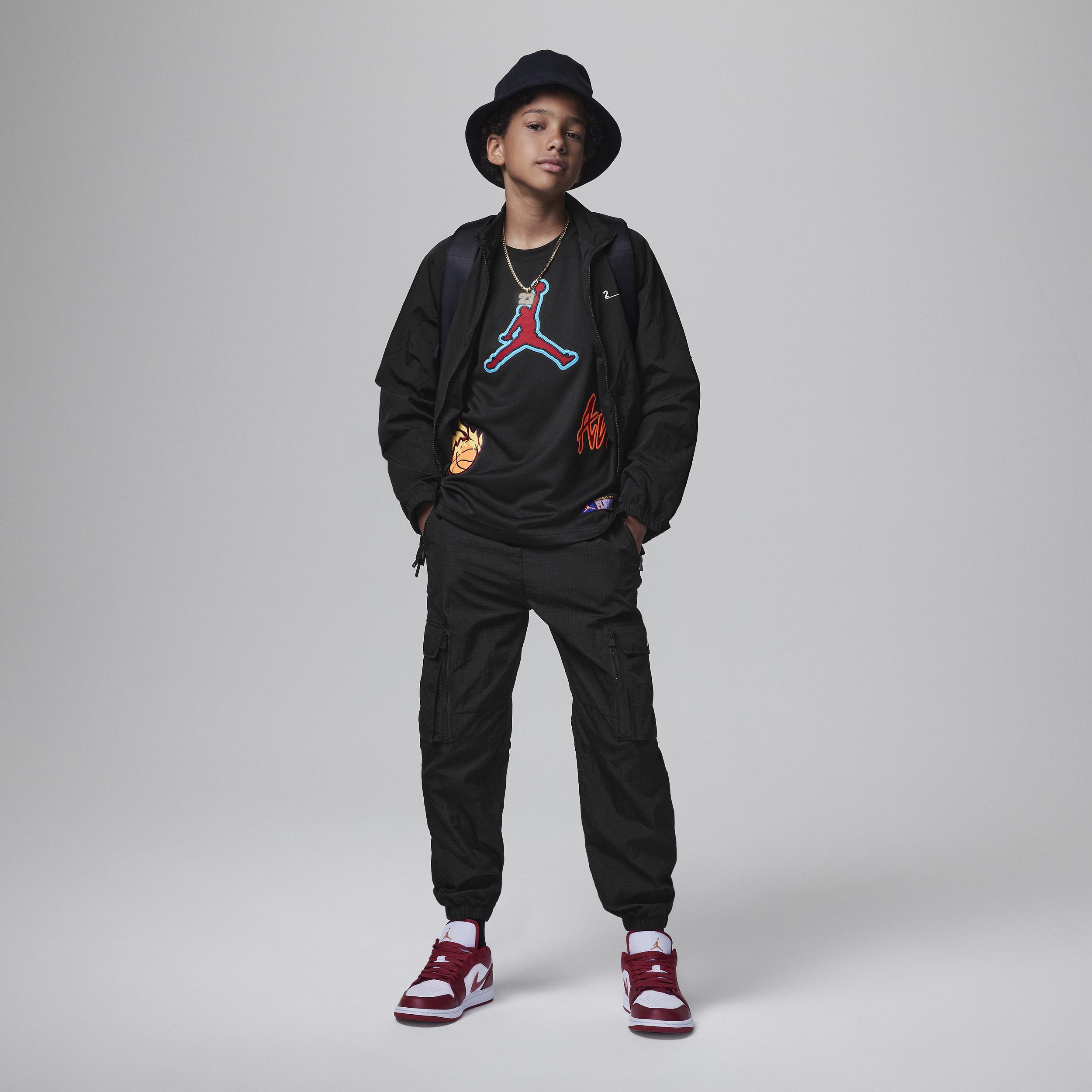 Buy Jordan Patch Pack Top Older Kids' Top - Black @ Nike Saudi