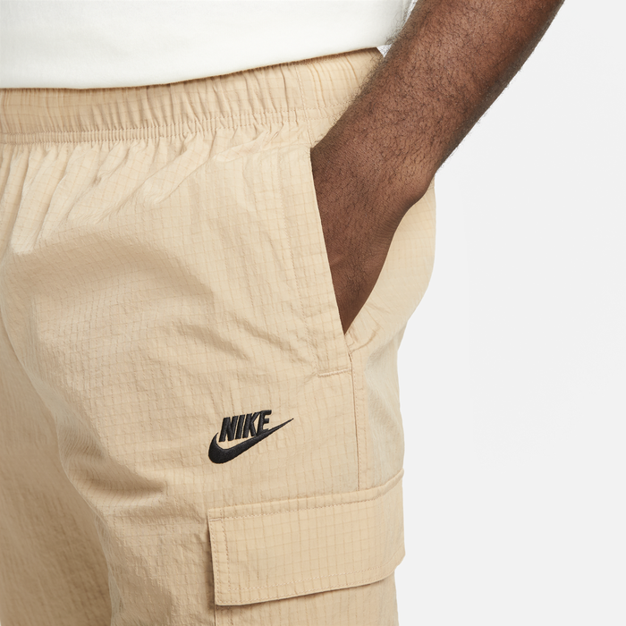 Shop Sportswear Repeat Men s Lightweight Woven Trousers Nike KSA