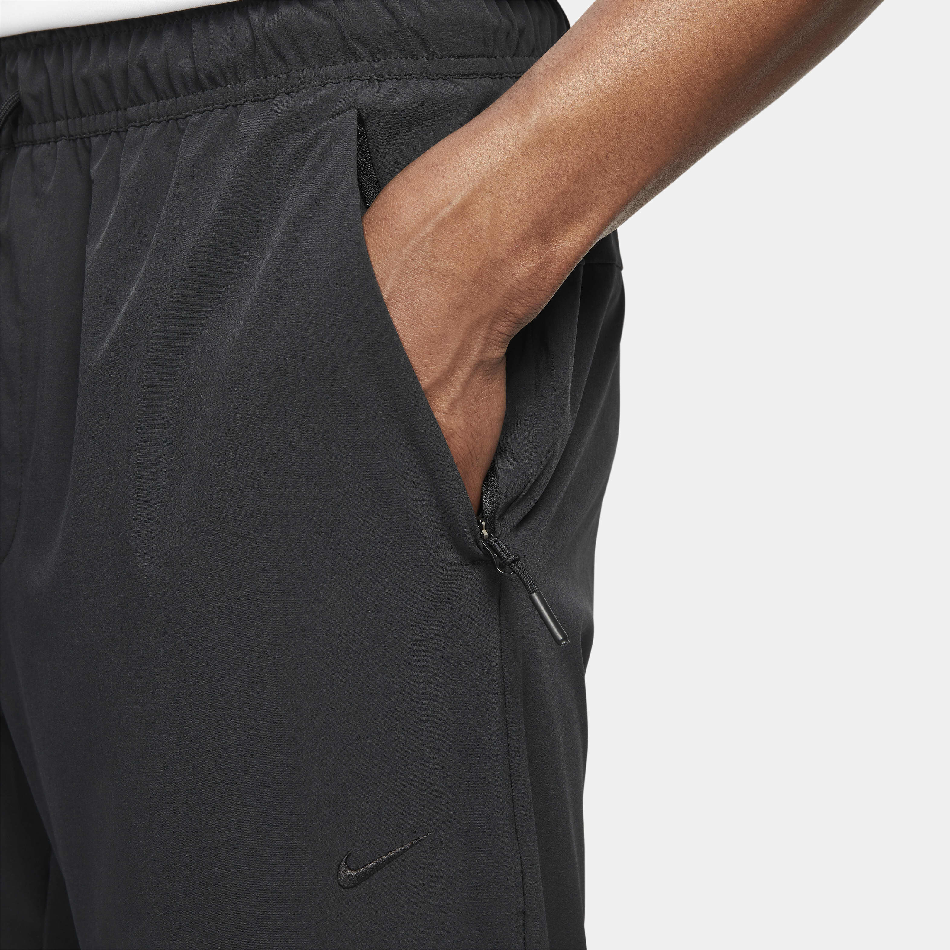 Buy Nike Unlimited Men s Dri FIT Zip Cuff Versatile Trousers Nike Saudi Official
