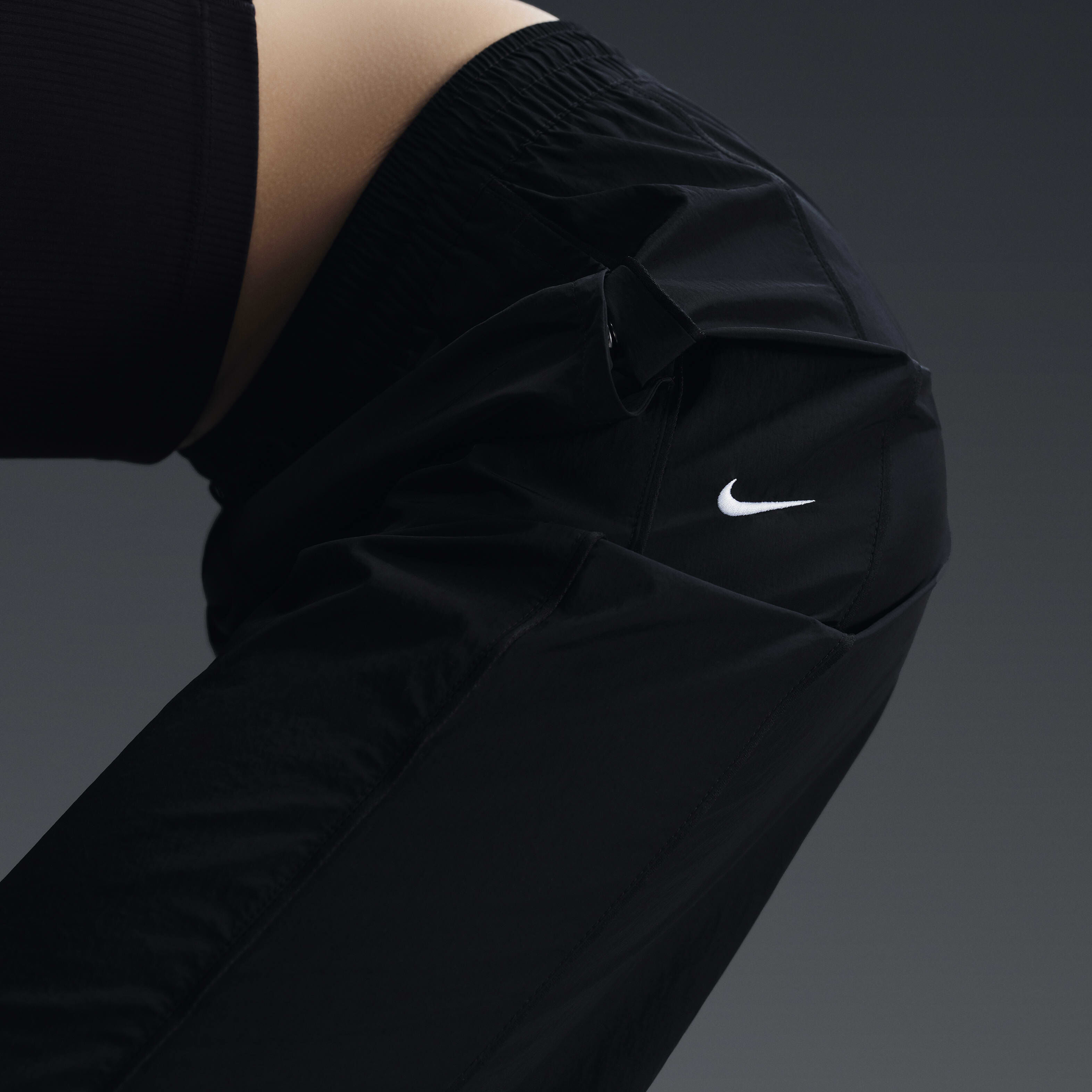 Buy Nike Windrunner Women s High Waisted Woven Open Hem Trousers Black White Nike Saudi Official