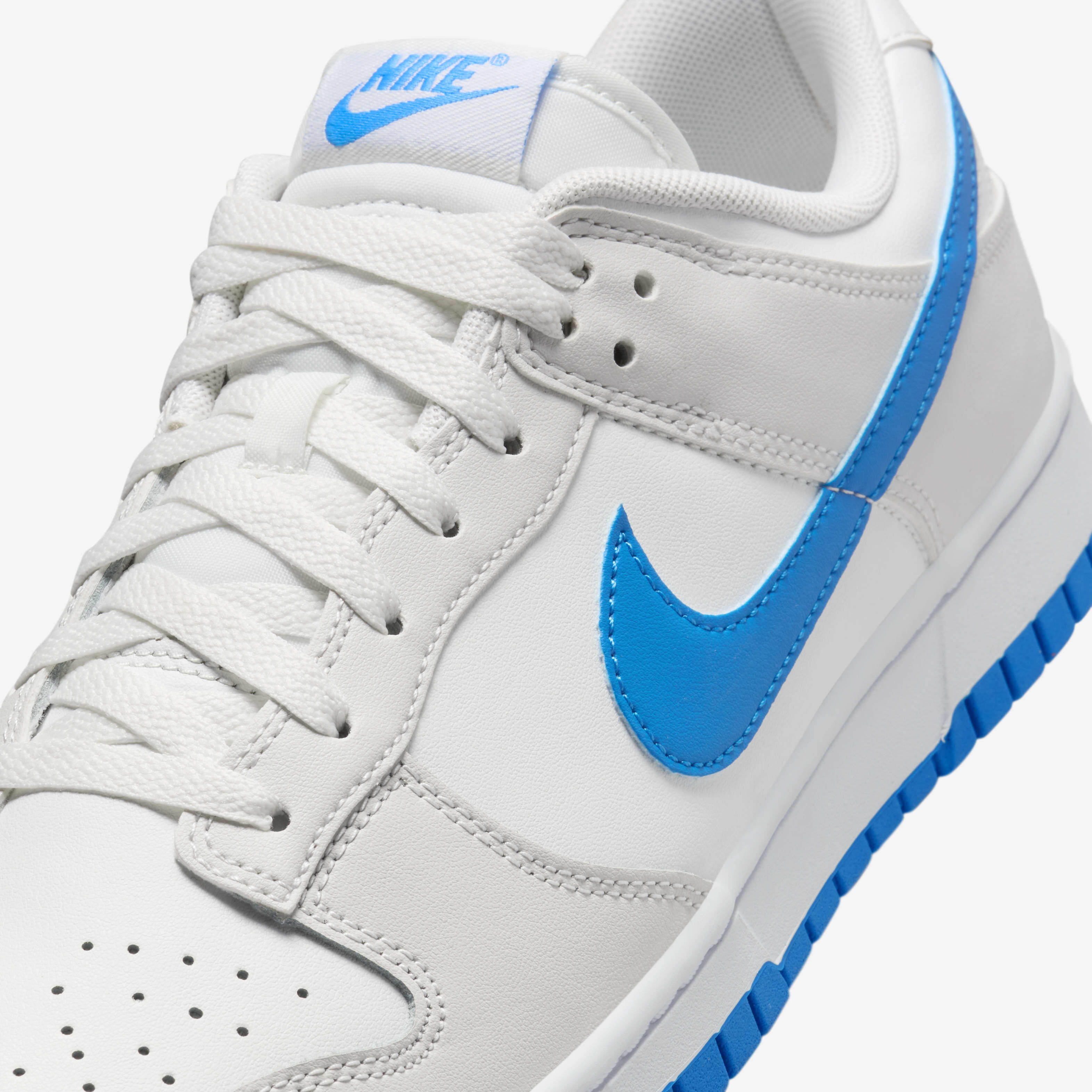 White nike shoes blue swoosh 2025