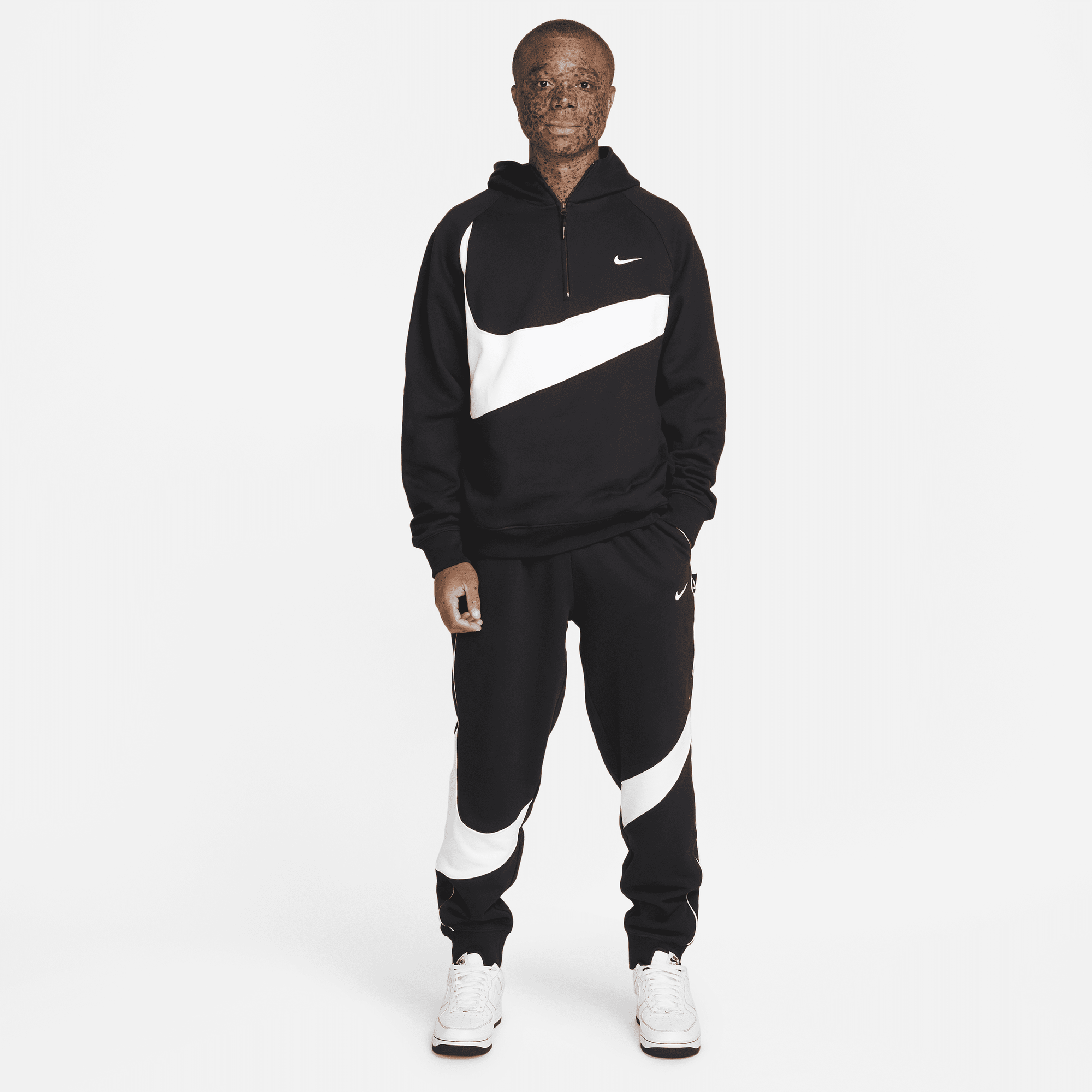 Nike swoosh hot sale logo tracksuit