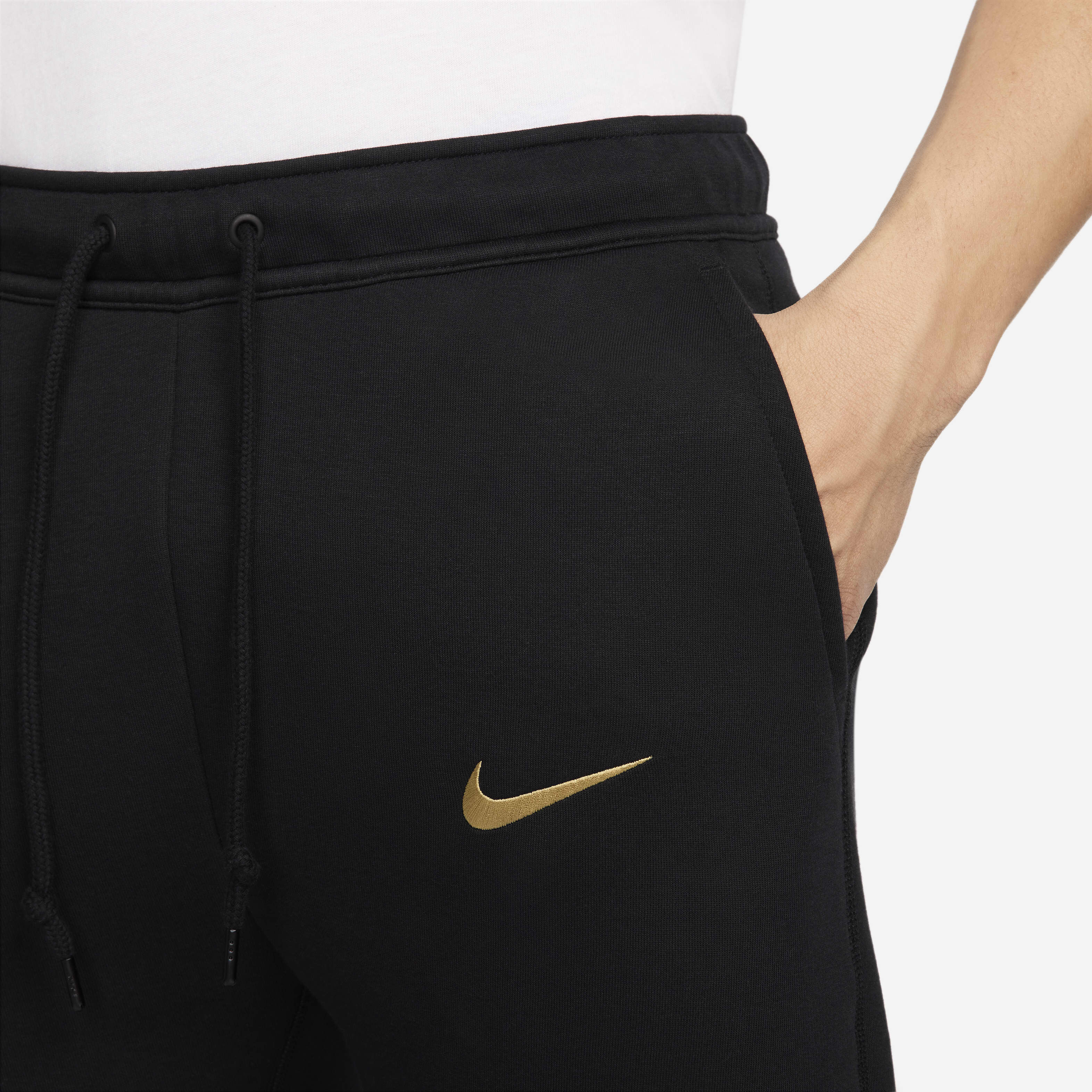 nike tech fleece black and gold