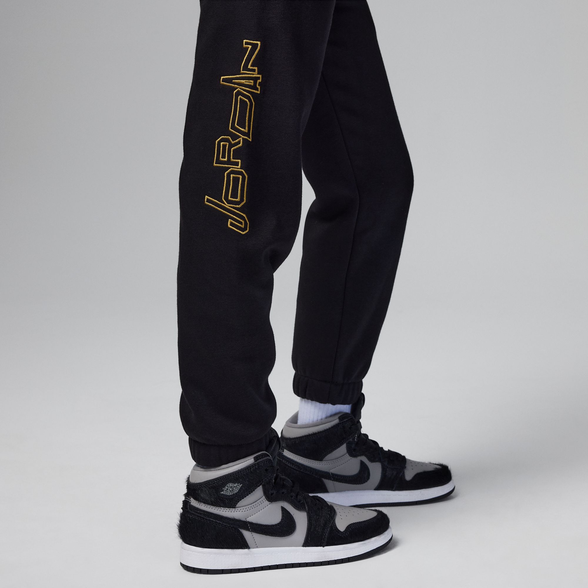 Black and gold jordan joggers top