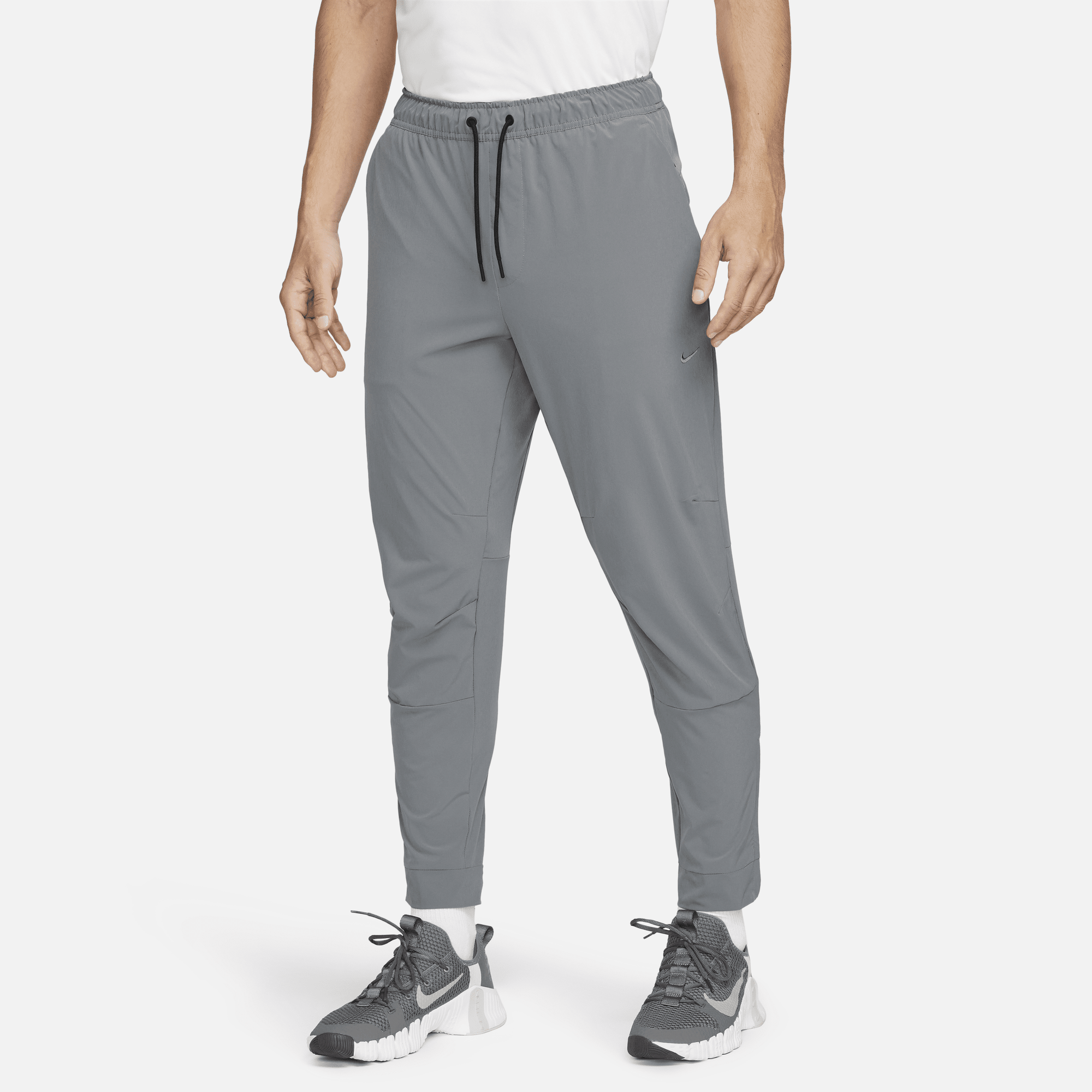 Shop Unlimited Men s Dri FIT Tapered Leg Versatile Trousers Nike KSA