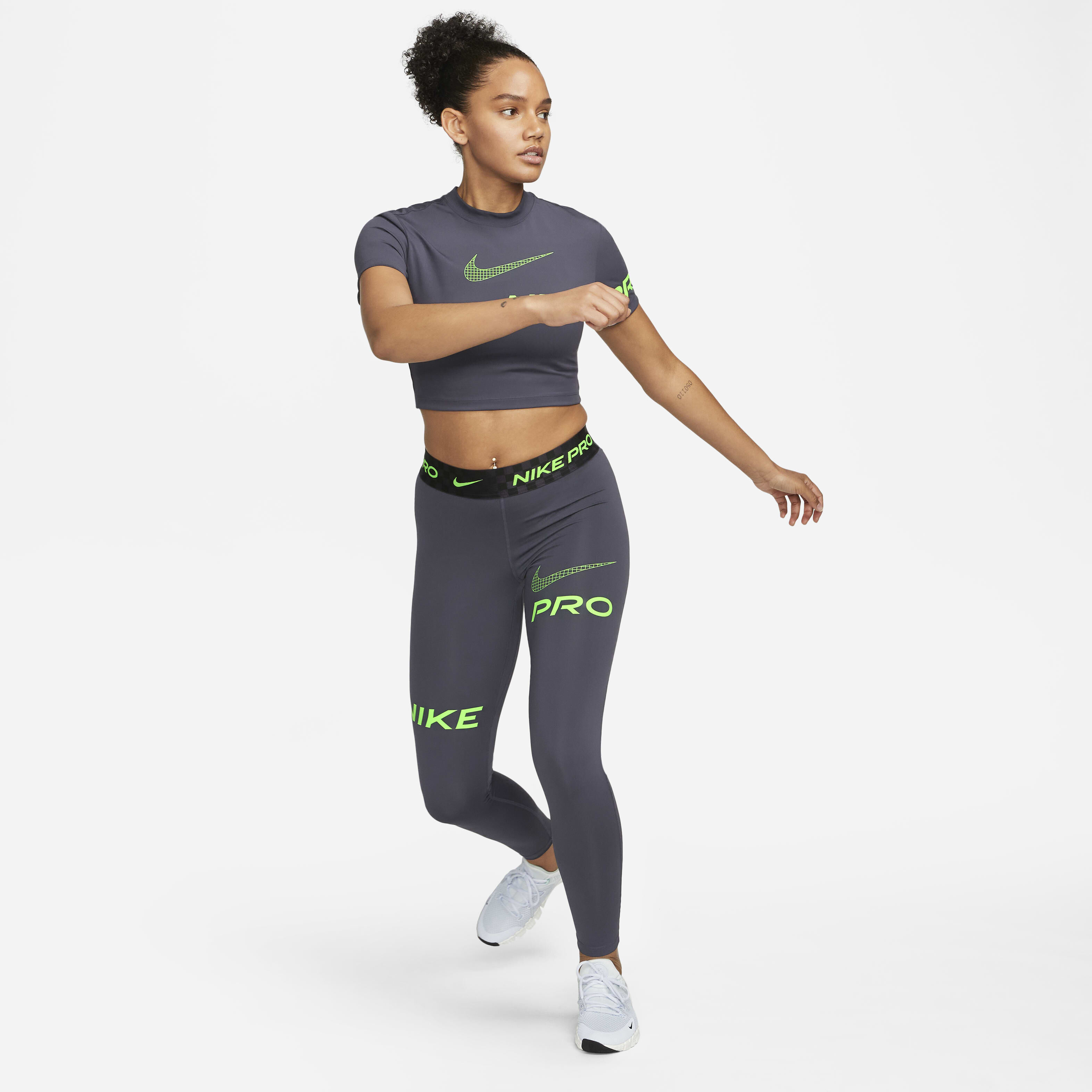 Buy Nike Pro Women s Mid Rise Full Length Graphic Training Leggings Gridiron Black Green Strike Nike Saudi Official