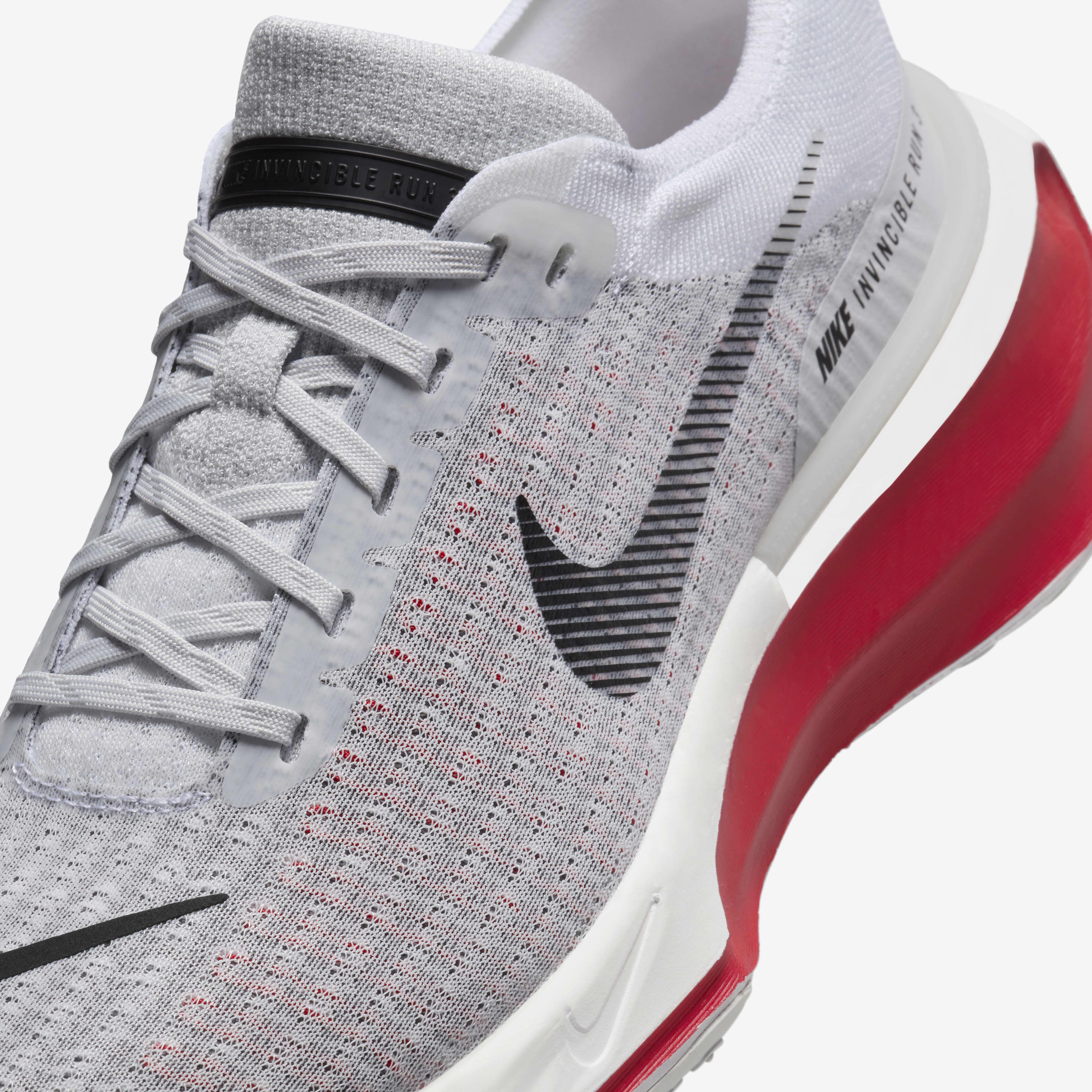 Nike grey and red running shoes sales