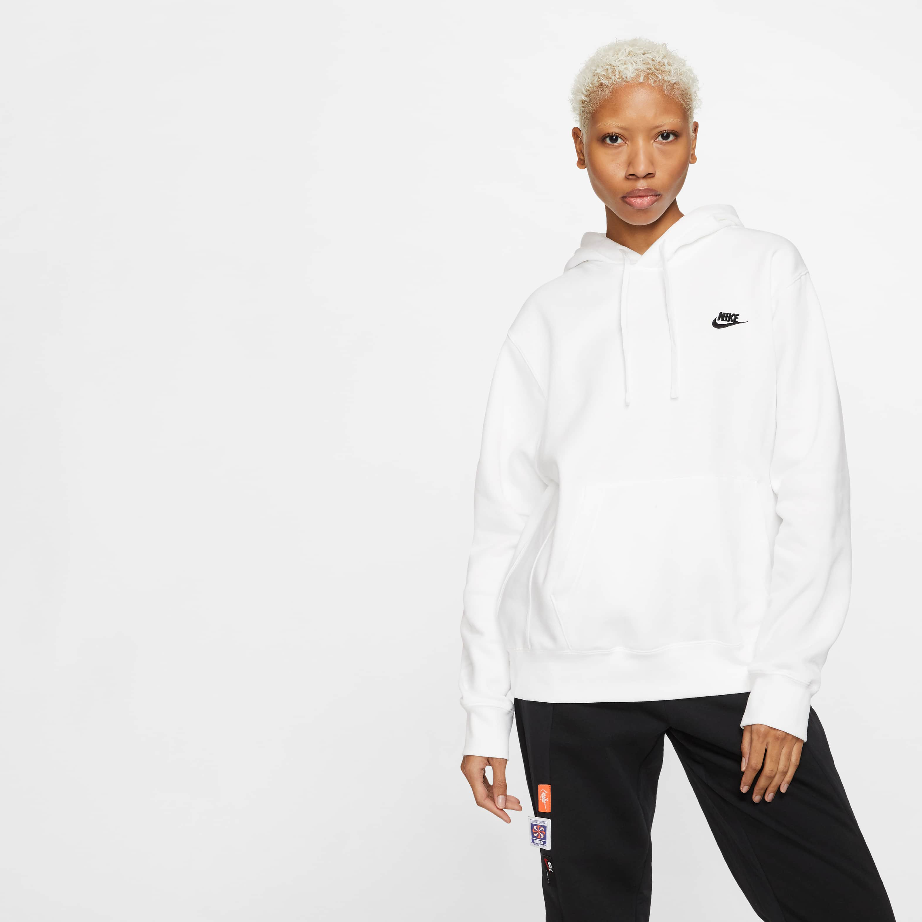 white nike jumper with black ticks all over