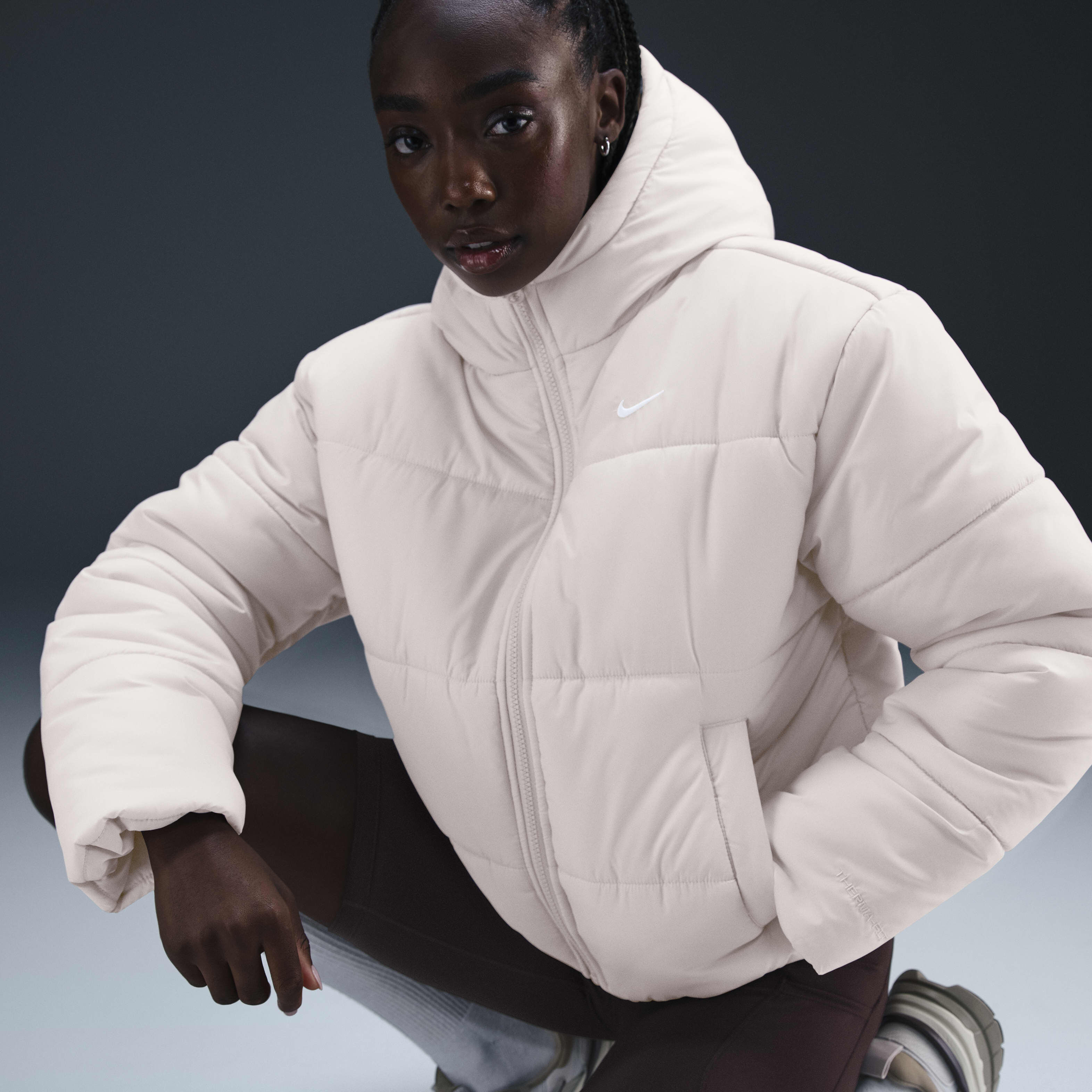Buy Nike Sportswear Classic Puffer Women s Therma FIT Loose Hooded Jacket Light Orewood Brown White Nike Saudi Official