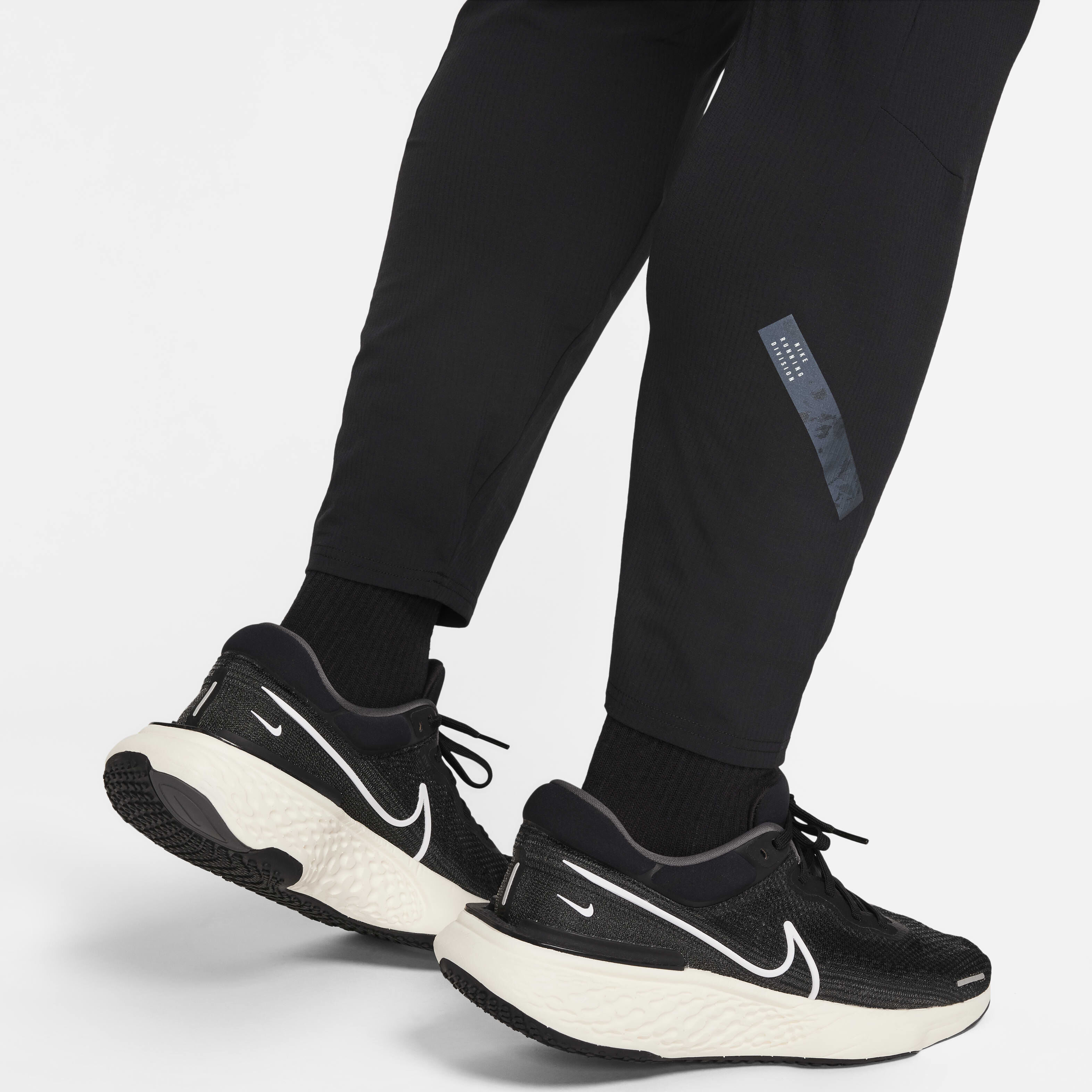 Buy Nike Dri FIT Running Division Phenom Men s Slim Fit Running Trousers Nike Saudi Official