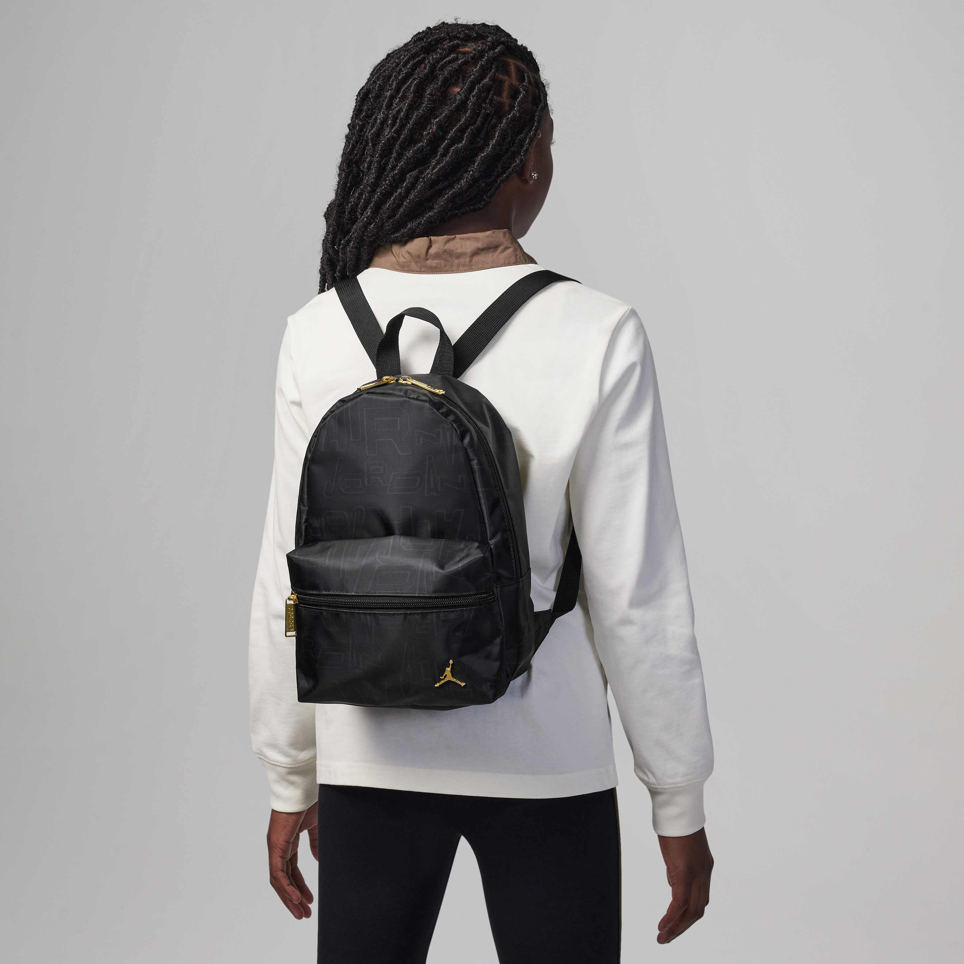 Jordan Black and Gold Mini Backpack image number 0