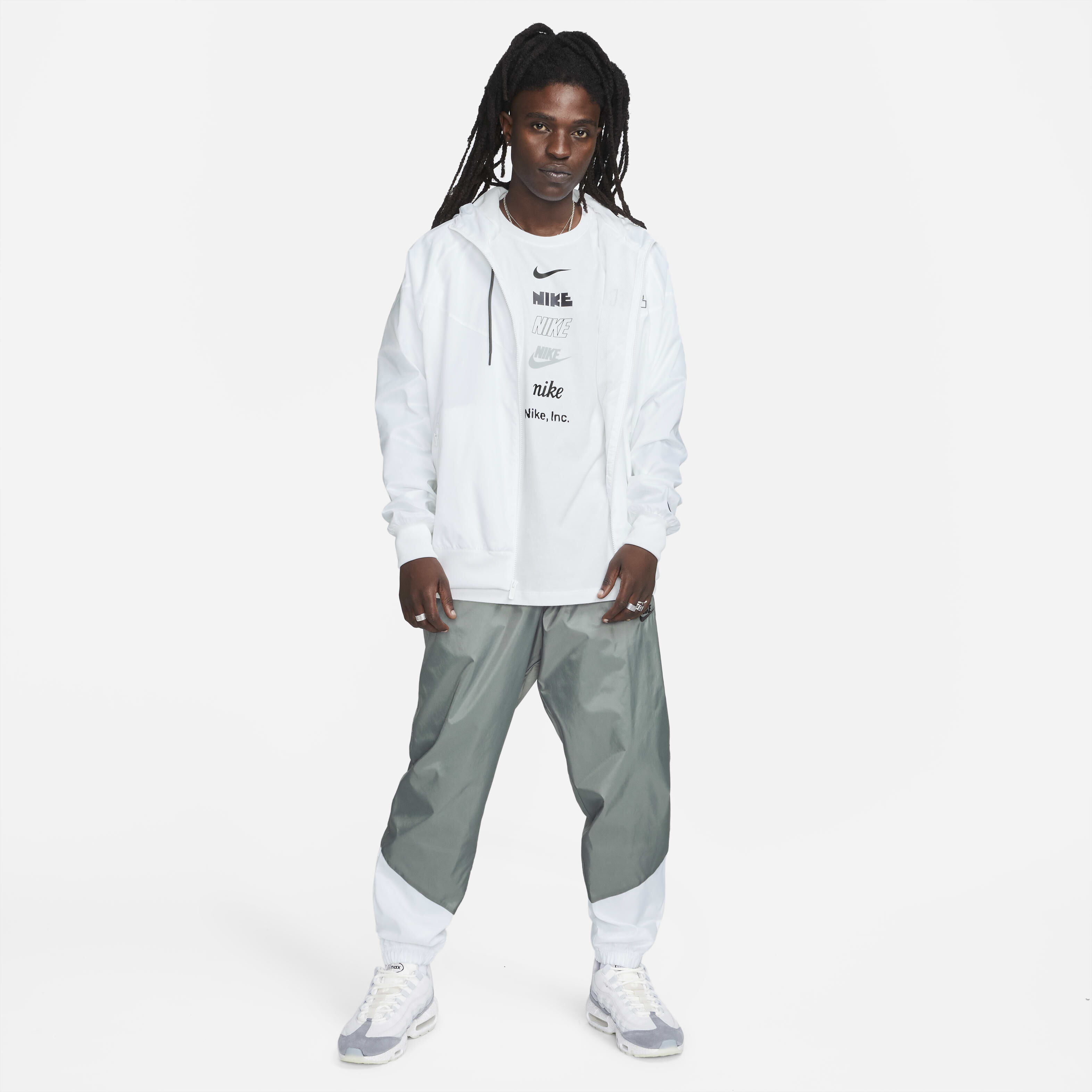 Buy Nike Windrunner Men s Woven Lined Trousers Smoke Grey White Black Nike Saudi Official