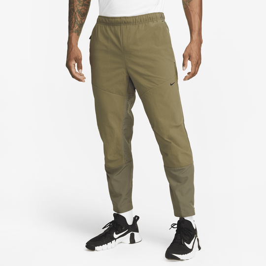 Shop APS Men s Dri FIT ADV Woven Versatile Trousers Nike KSA
