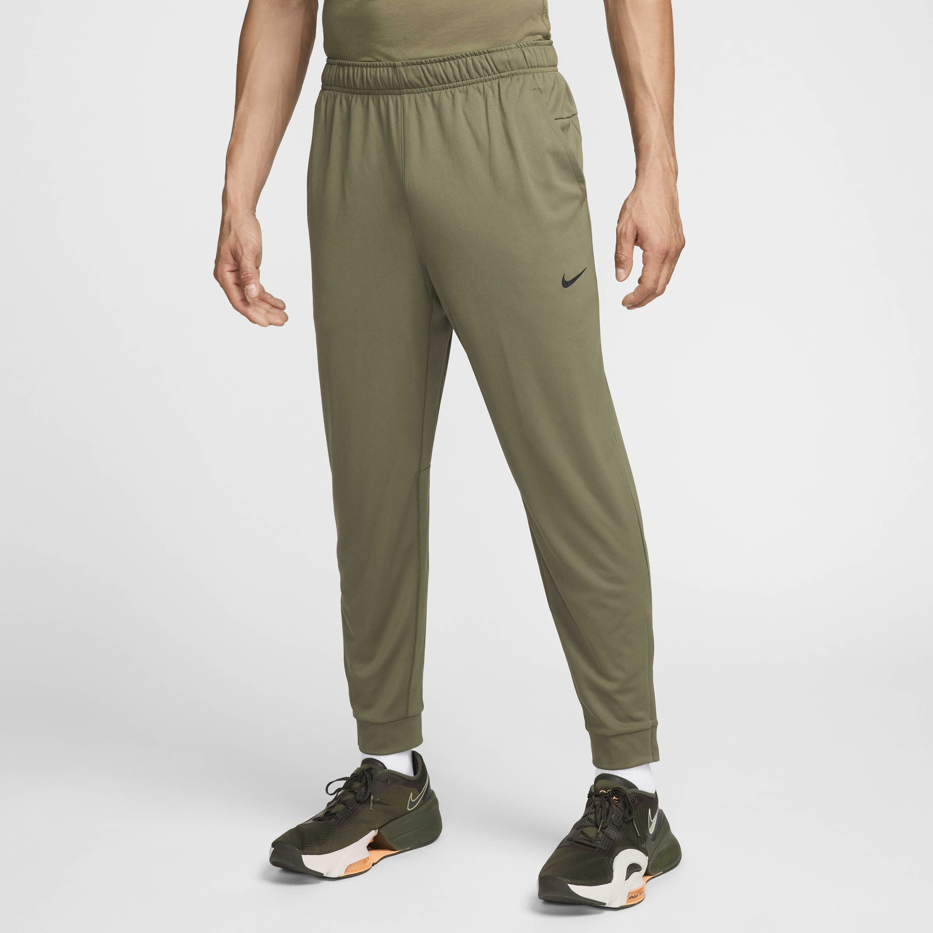 Buy Nike Totality Men s Dri FIT Tapered Versatile Trousers Nike Saudi Official