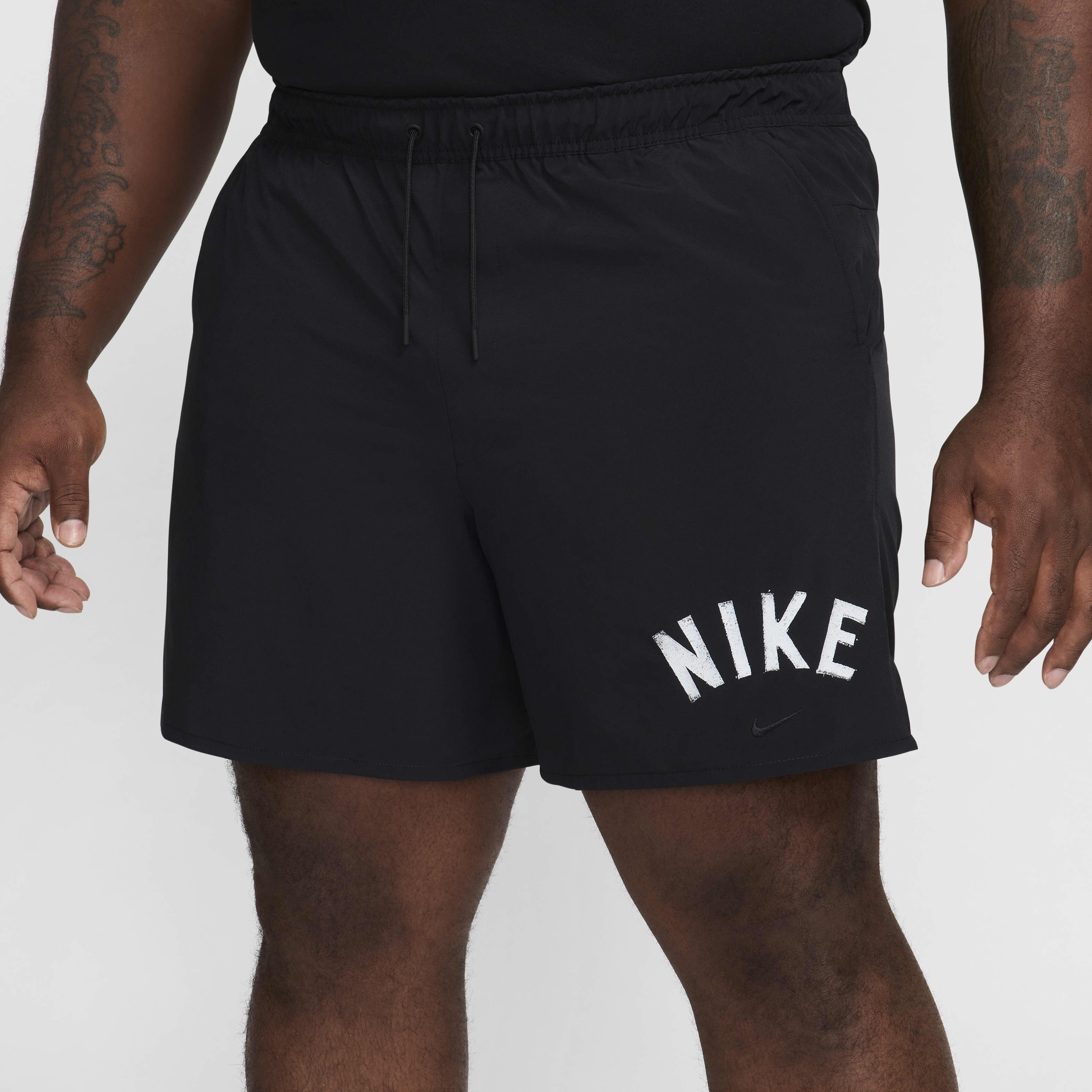 Buy Nike Unlimited Swoosh Men s 18cm approx. Dri FIT Unlined Versatile Shorts Black White Nike Saudi Official