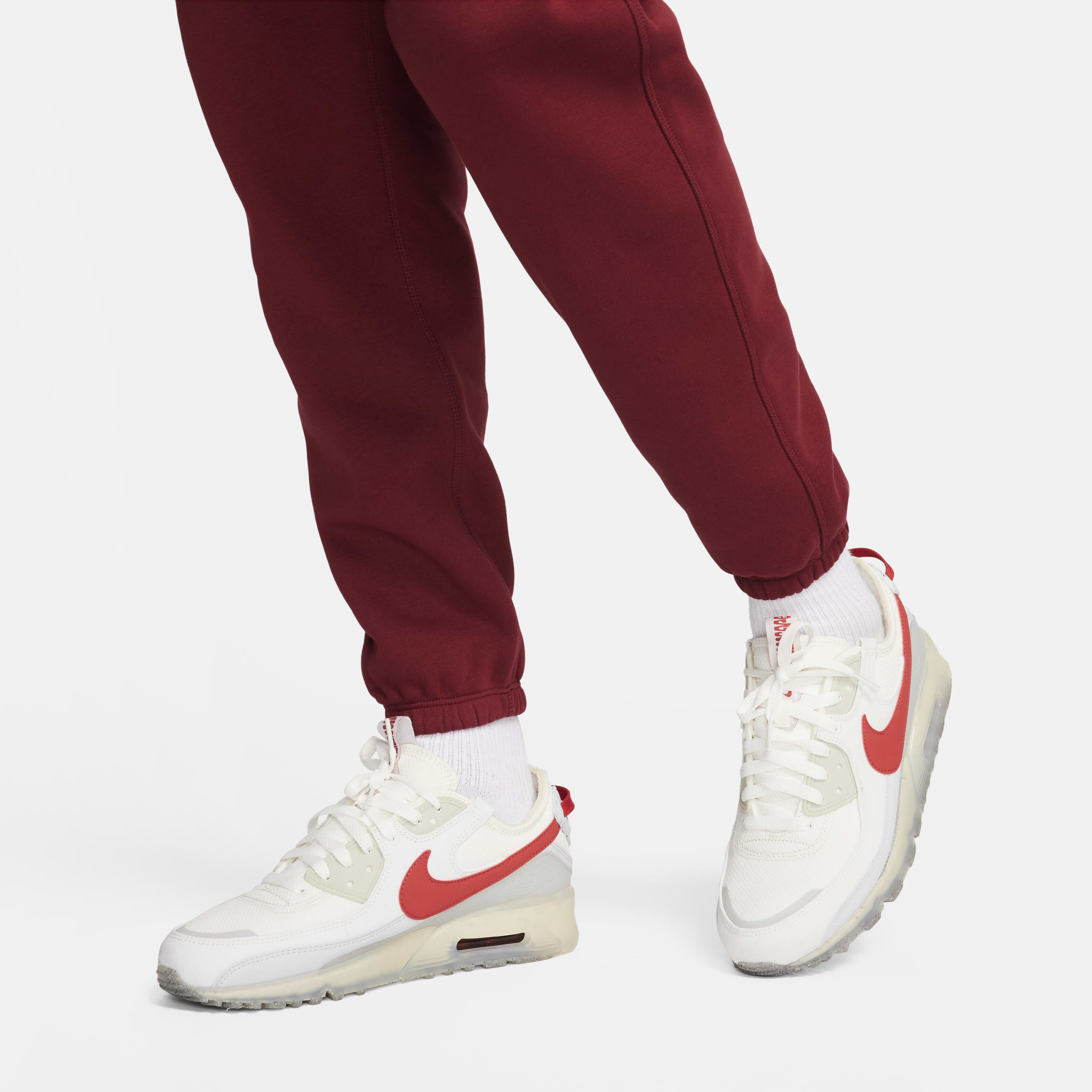 Buy Nike Club Fleece Men s Cuffed Trousers Team Red Safety Orange Nike Saudi Official
