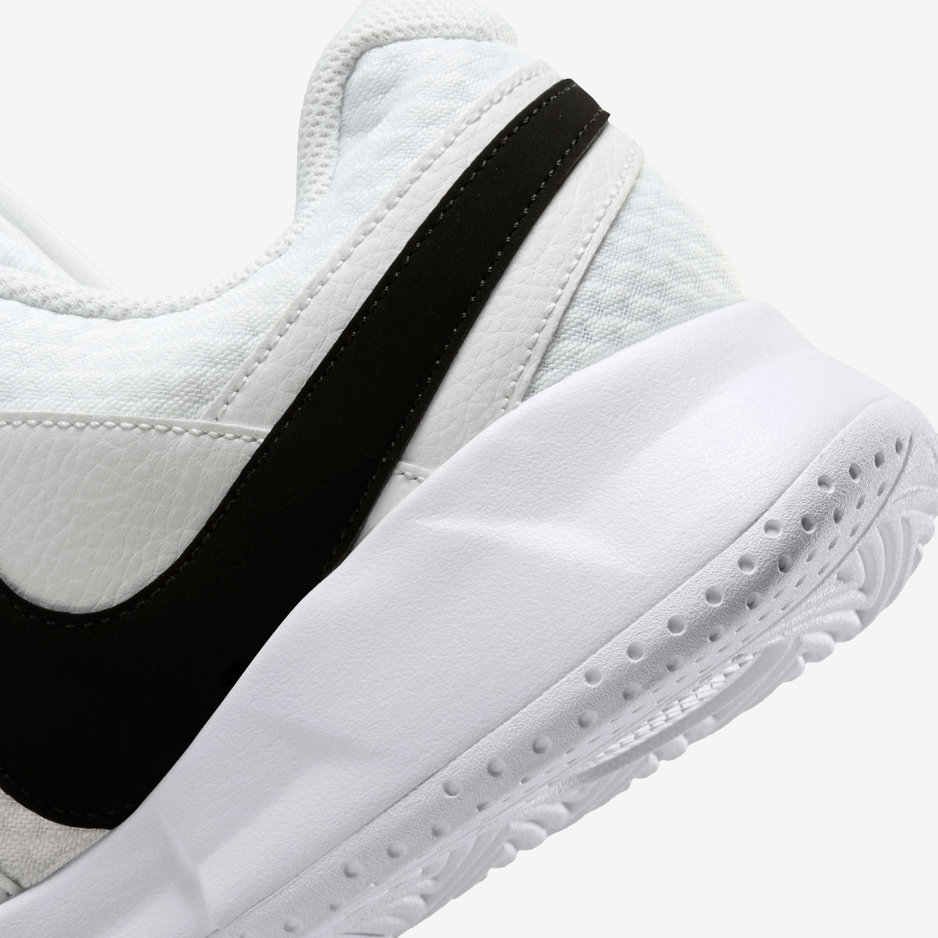 white and black nike tennis shoes