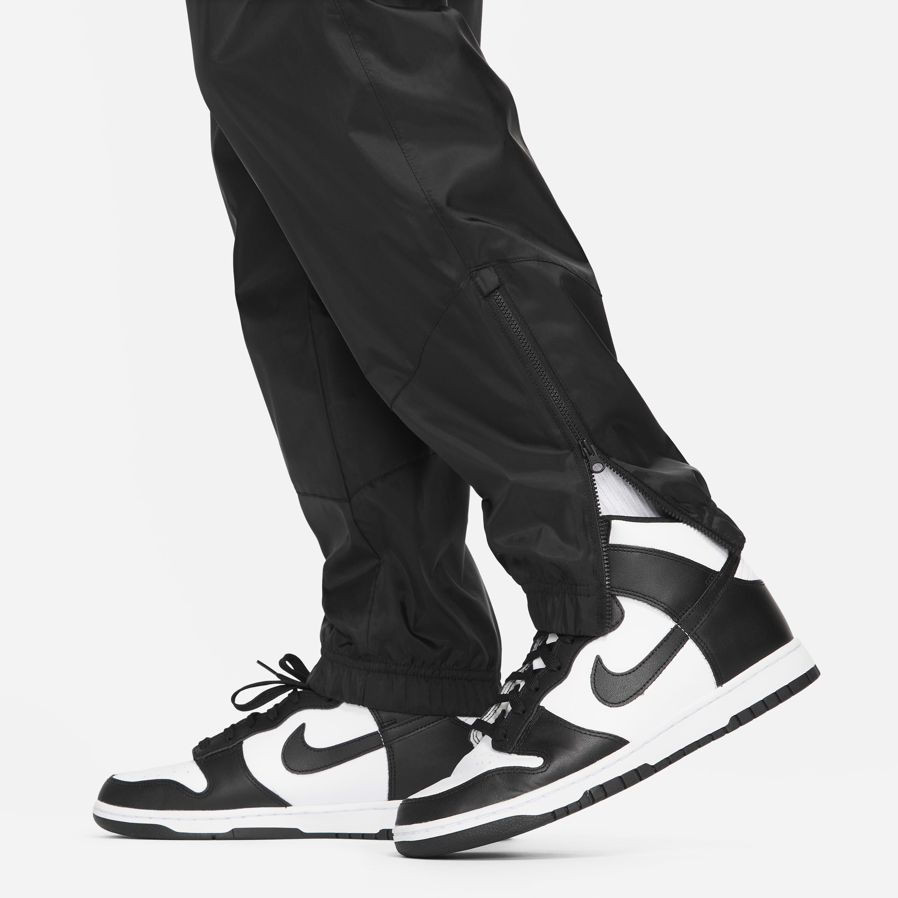 Buy Nike Windrunner Men s Woven Lined Trousers Black Black White Nike Saudi Official