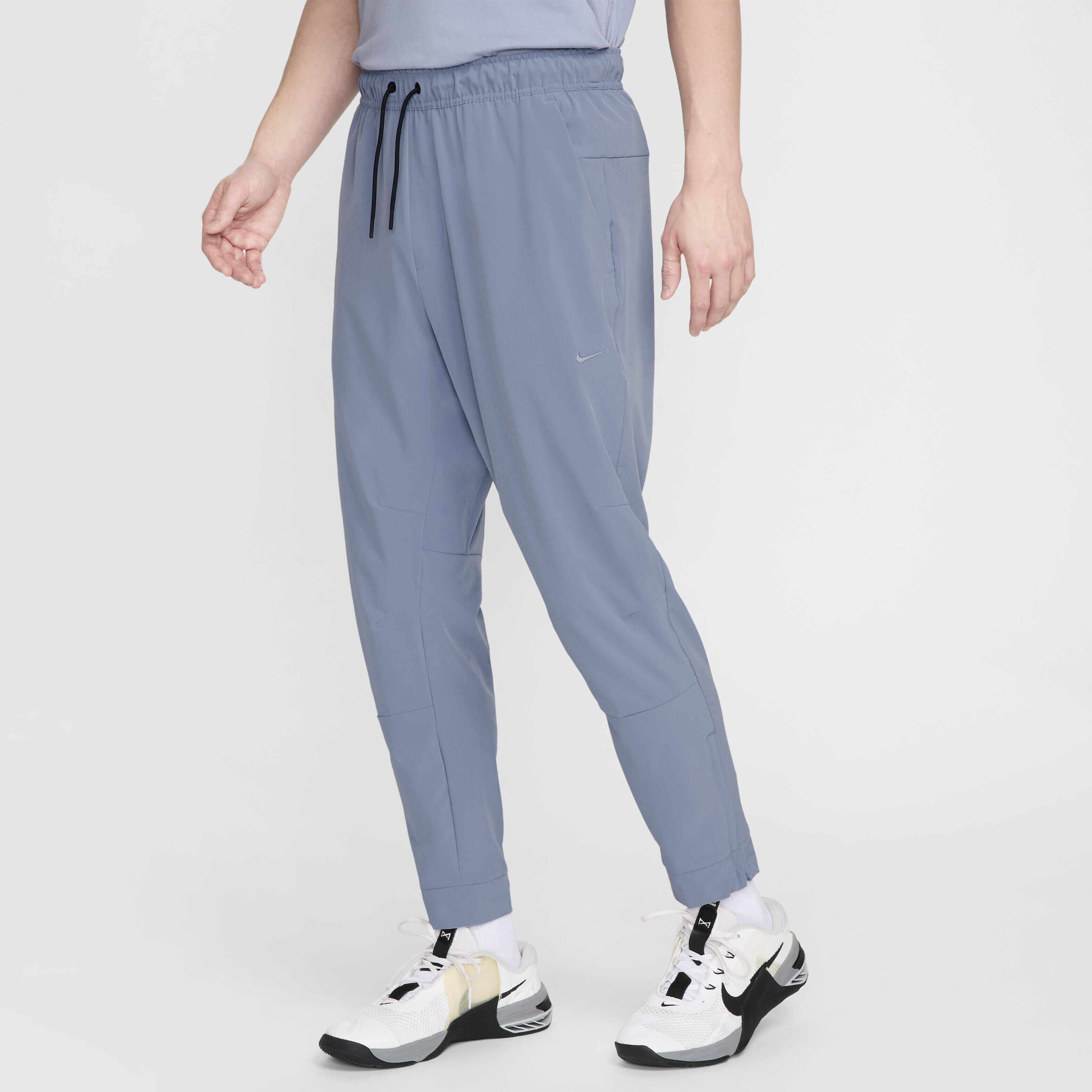 Buy Nike Unlimited Men s Dri FIT Zip Cuff Versatile Trousers Nike Saudi Official