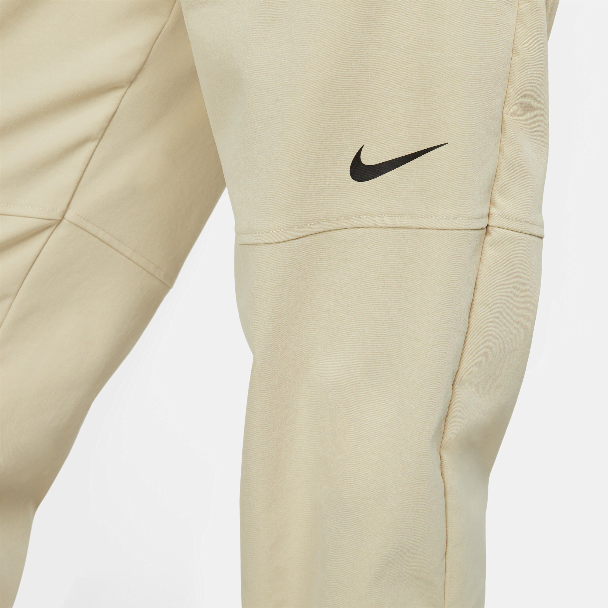 Nike swoosh cuffed hotsell woven sweatpants in khaki