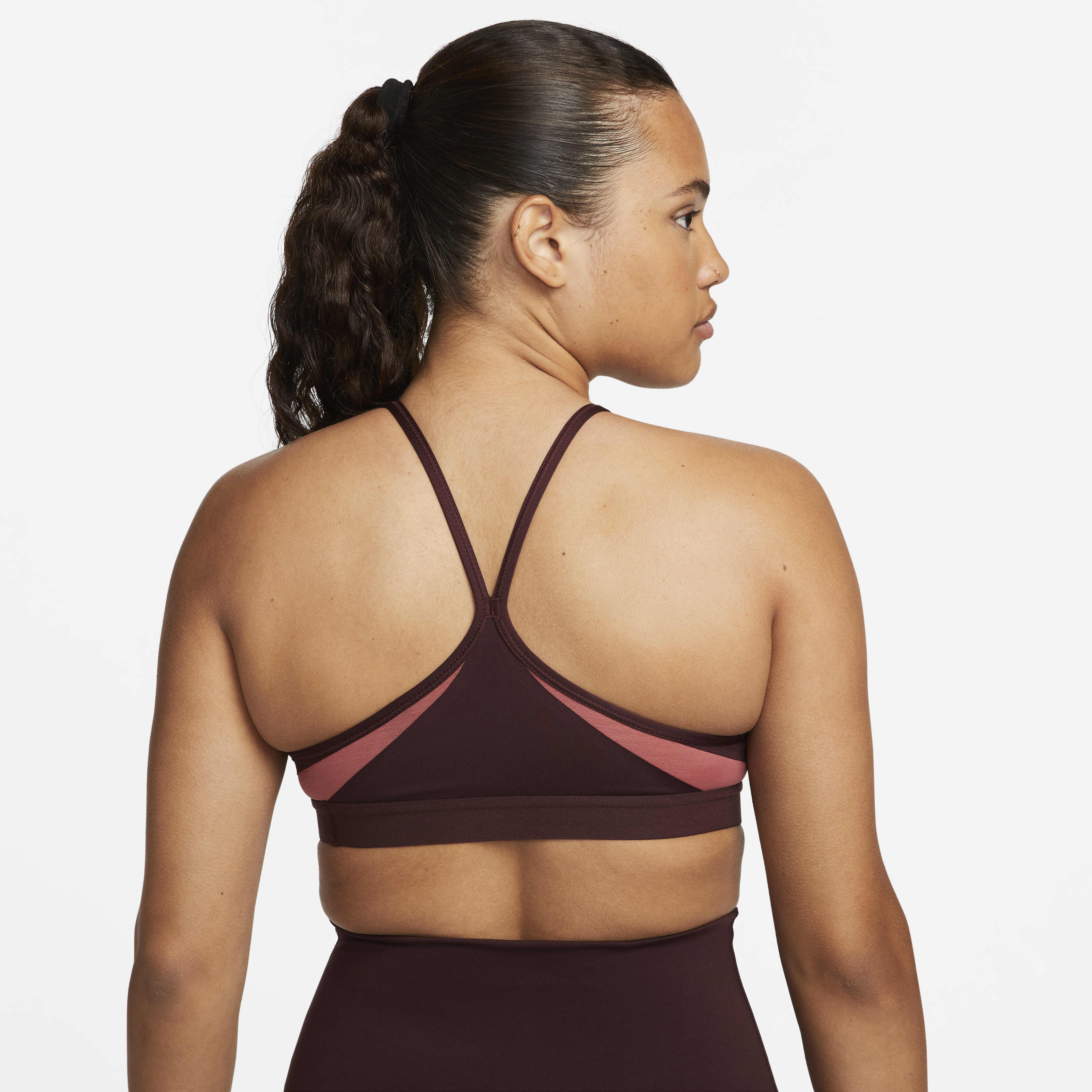 Buy Nike Indy Women s Light Support Padded V Neck Sports Bra Burgundy Crush Cedar Burgundy Crush White Nike Saudi Official