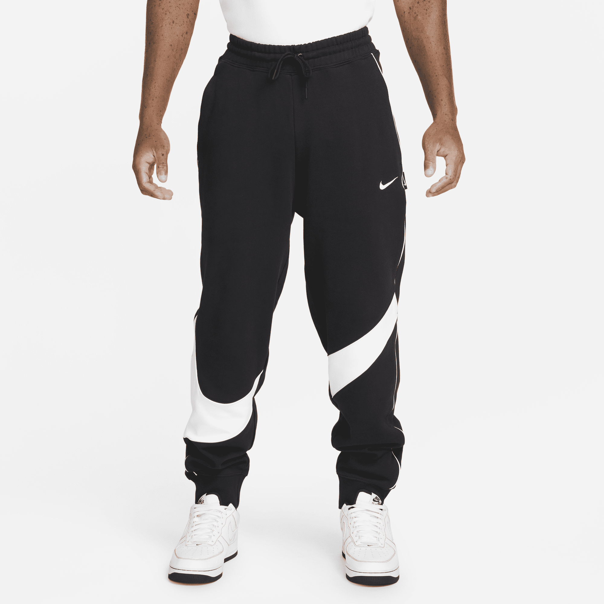 Big swoosh nike pants discount